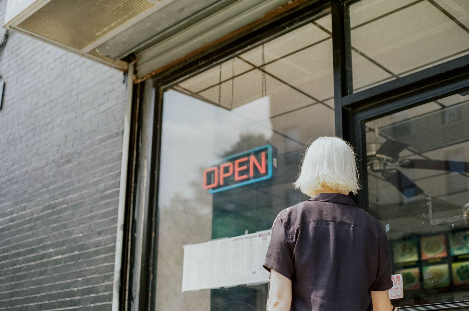 35mm kodak gold photography woman getting deli food