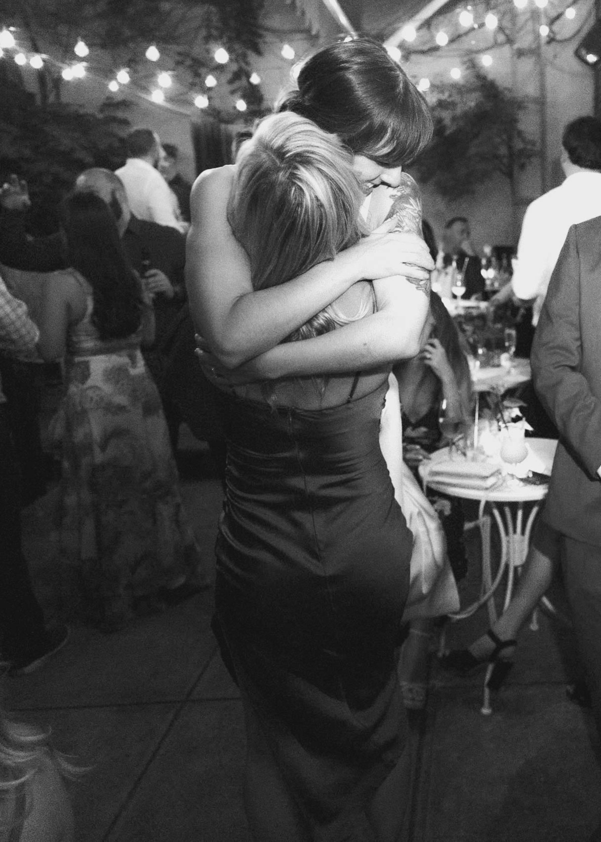 Wedding party, candid and fun. black and white. The bride is having an amazing time with her guests. Brooklyn