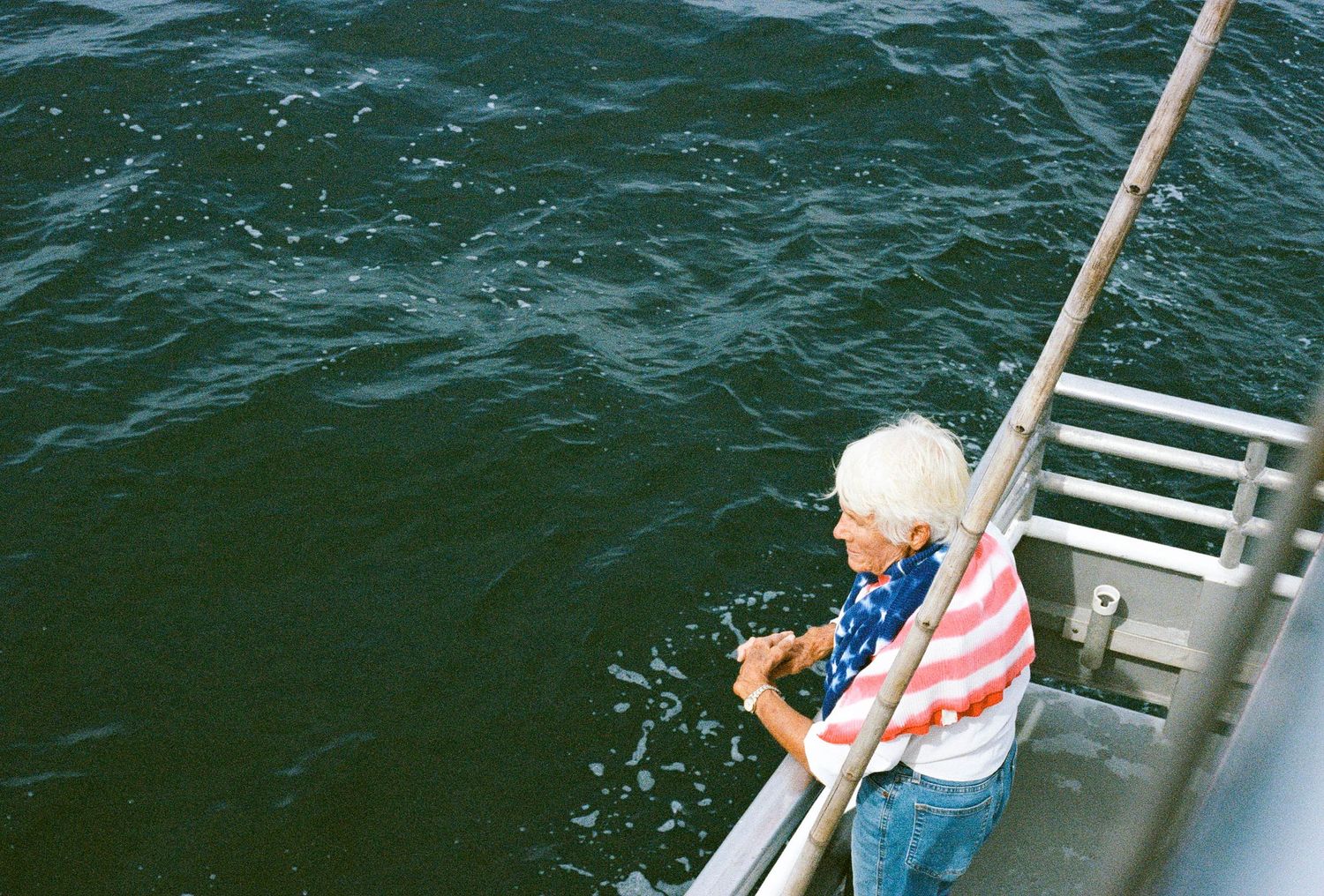 whale watching boat tour, photojournalist view. 35 mm film a24 vibes