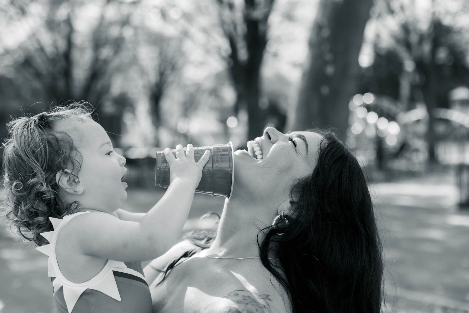 black and white Candid, playful family photography. Mommy and me moments captured in Brooklyn.