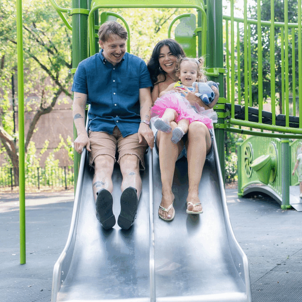 Candid, playful family photography in park