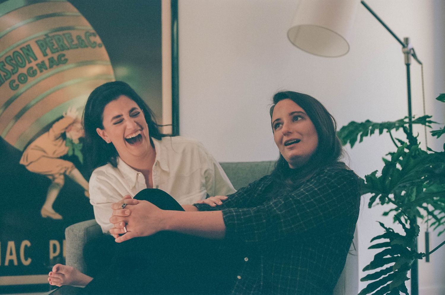 bride getting ready on 35 mm film, candid laughing with friends