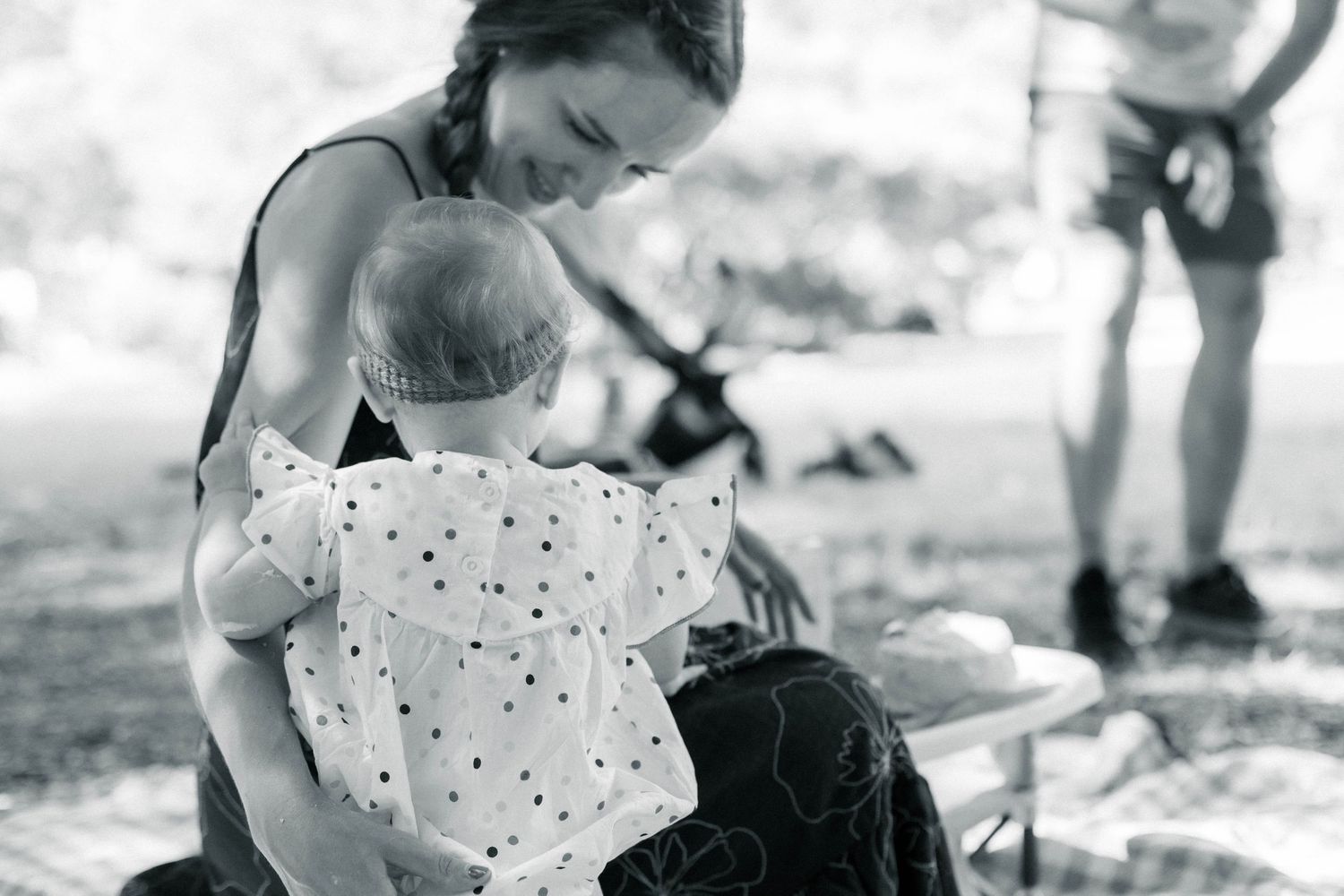 black and white Candid, playful family photography. Baby's first birthday and the smash cake moment. Film + digital