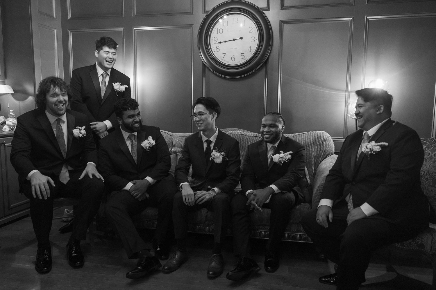Candid wedding party moment photographed in a documentary wedding photography style