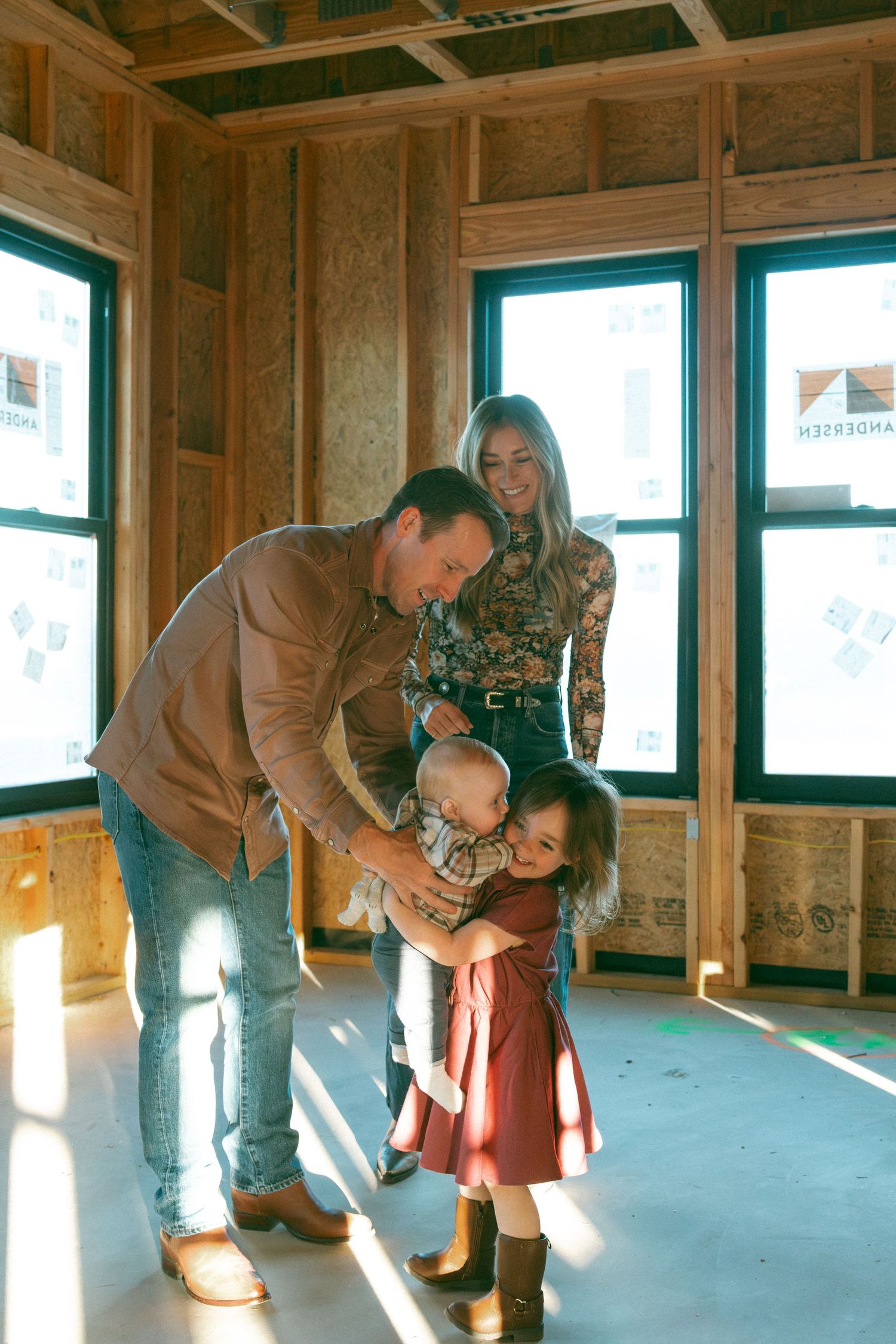 A sequence of images showing someone bending down to pick up confetti or small objects from a wooden floor in a sunlit room.