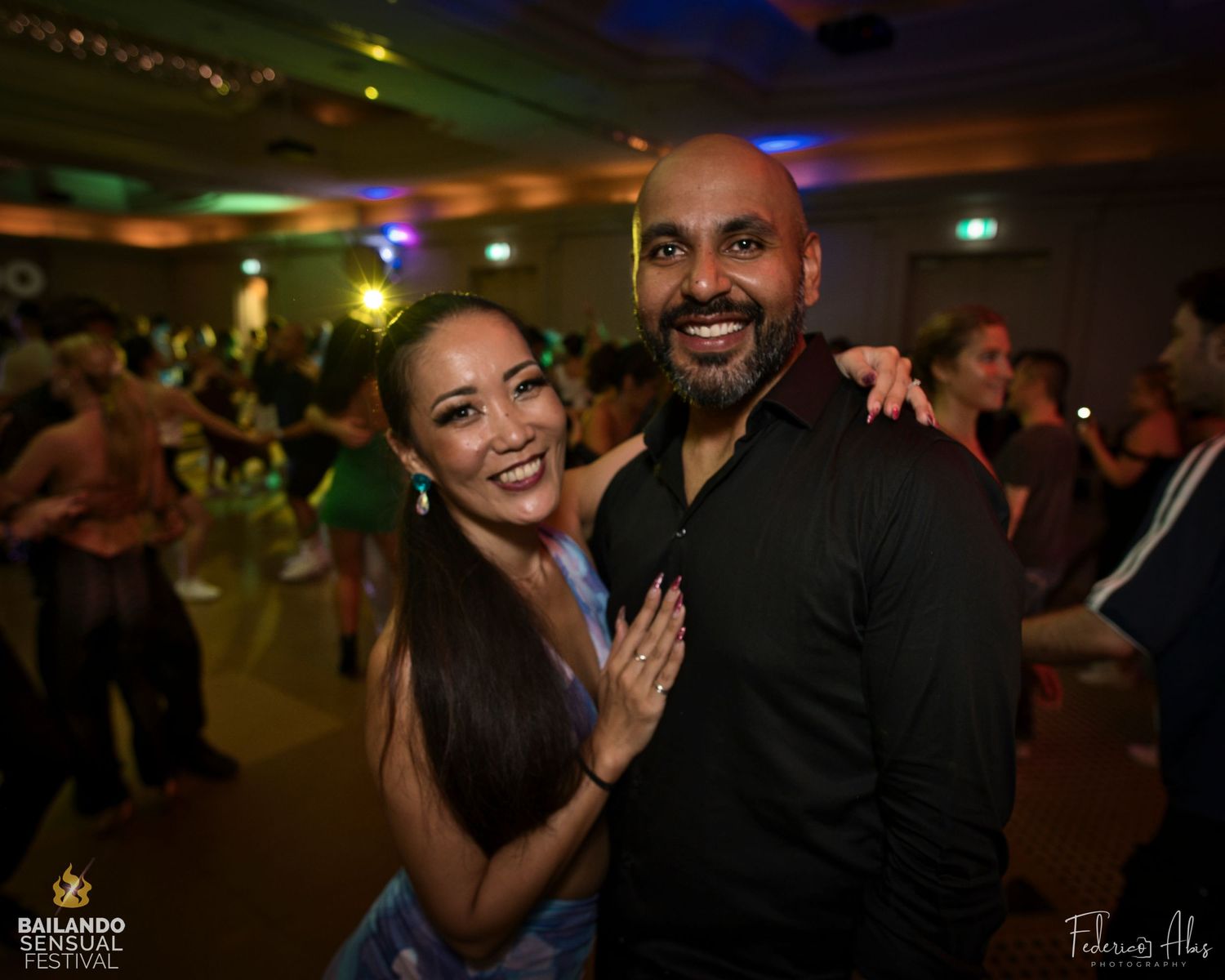 Dance partners sharing a joyful moment at a social dance party.