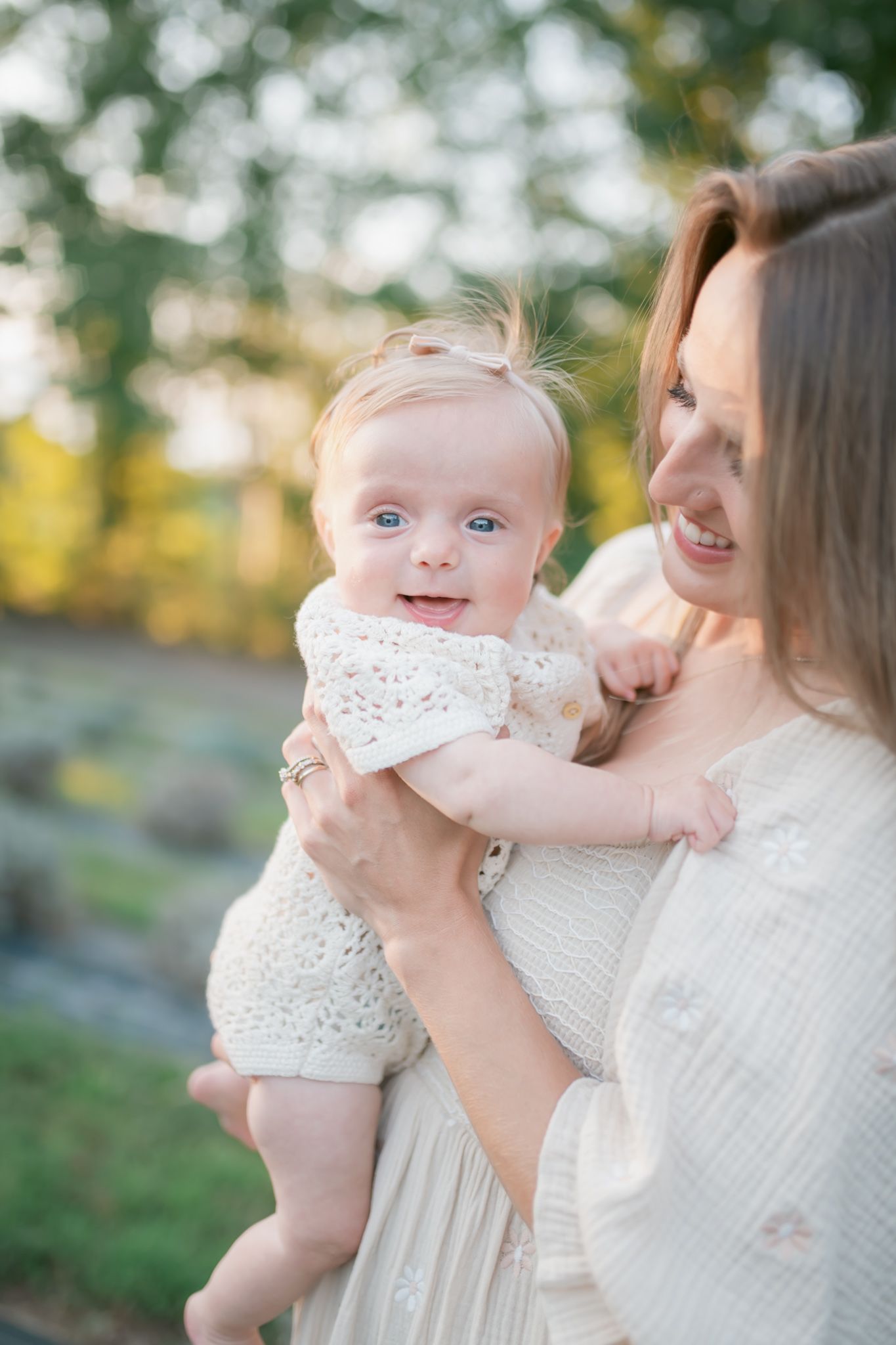 Sweet moment captured outdoors in soft natural lighting.