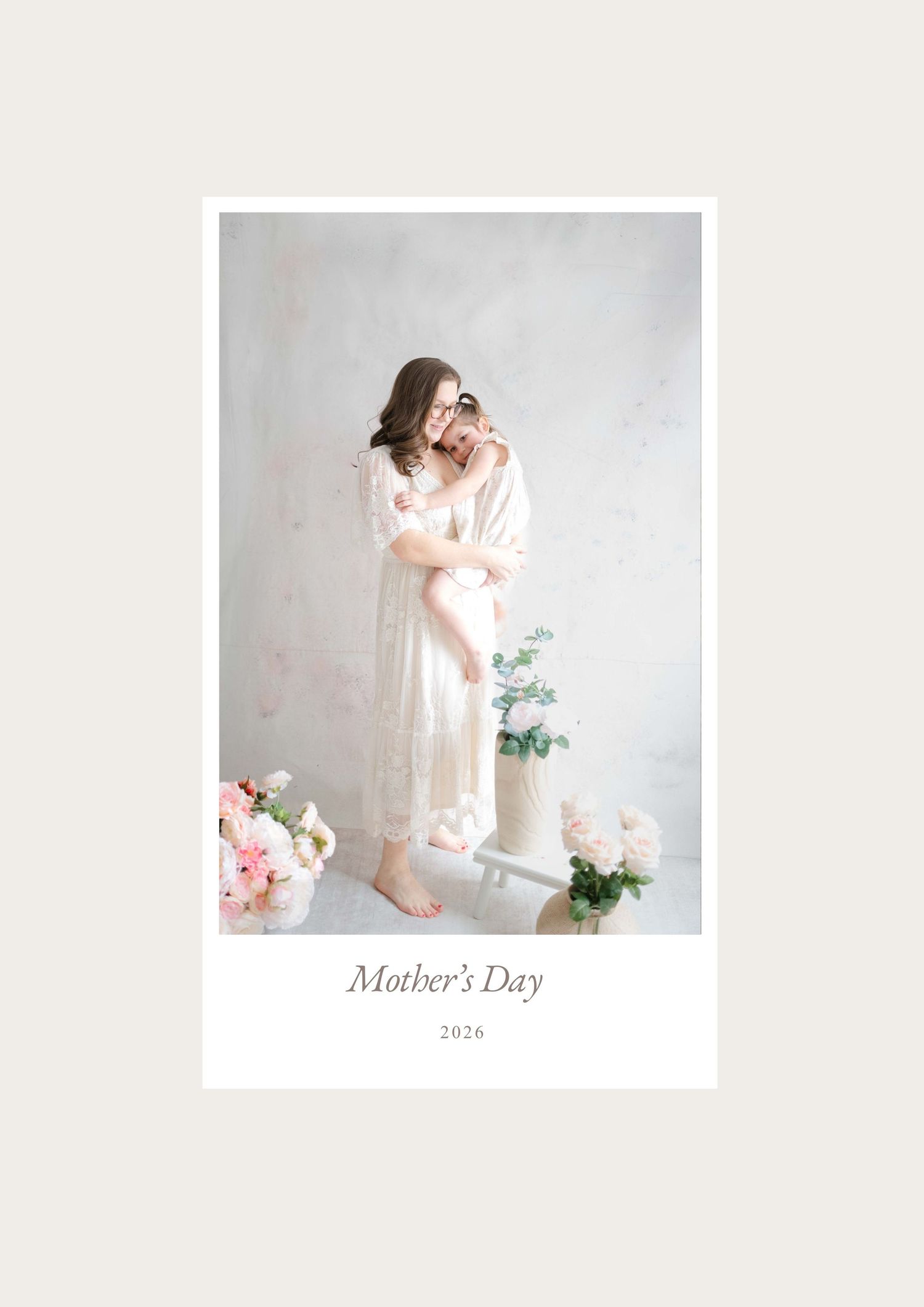 Motherhood portrait session with soft florals and white dress in a natural light studio in Chesterfield Virginia
