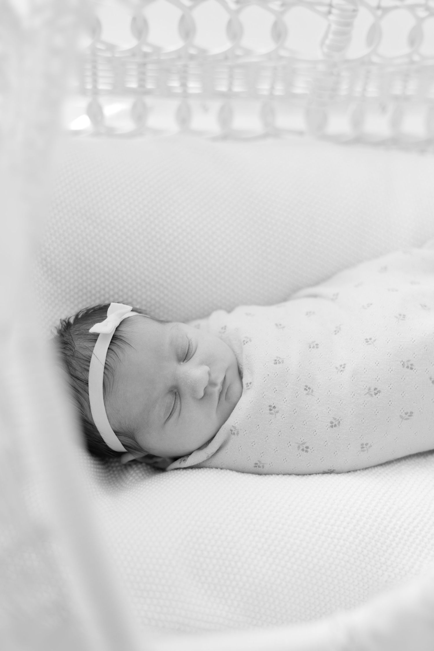 Black and white photo of a sleeping newborn asleep during lifestyle newborn session