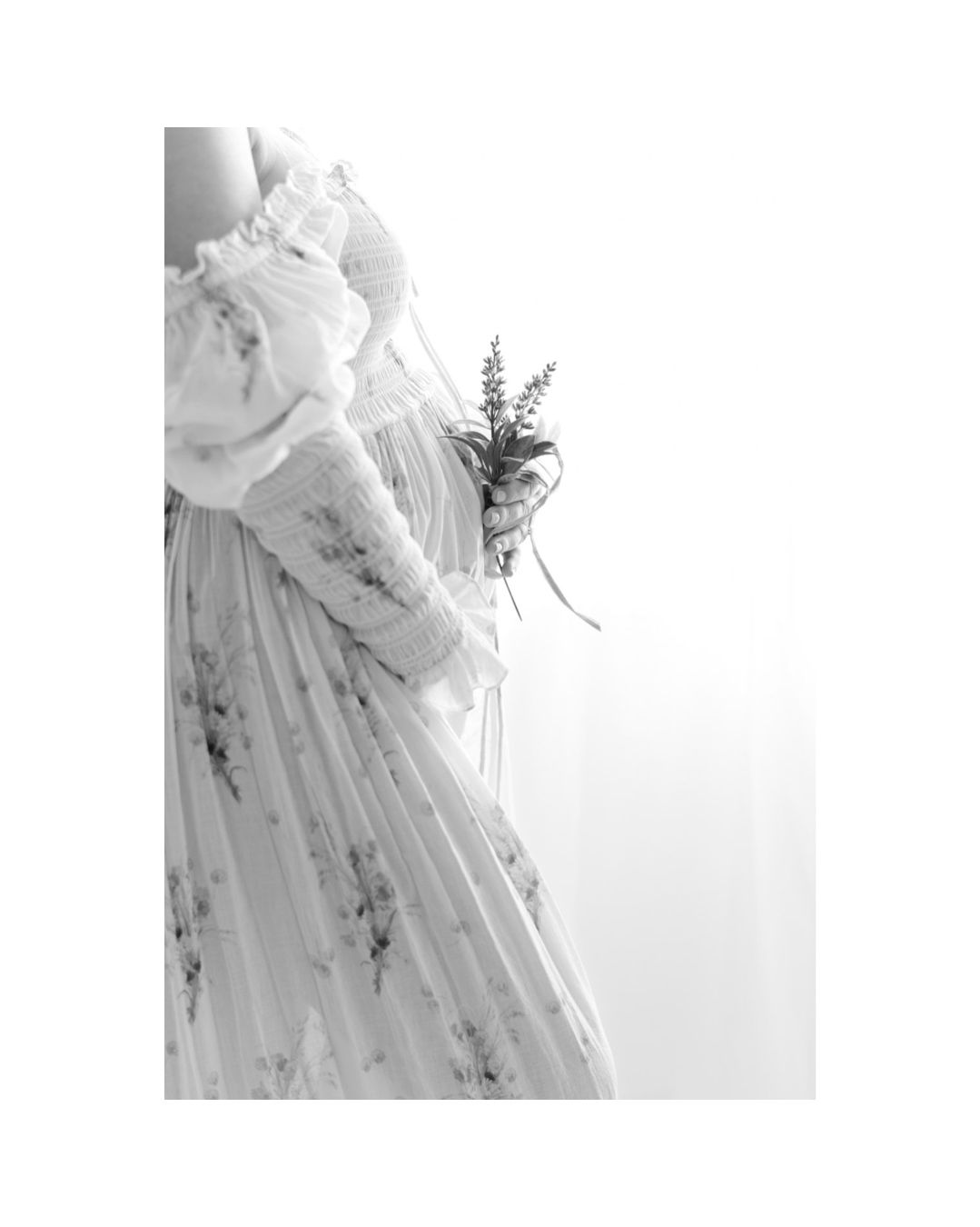 Black and white maternity portrait of an expecting mother in a Richmond Virginia photography studio