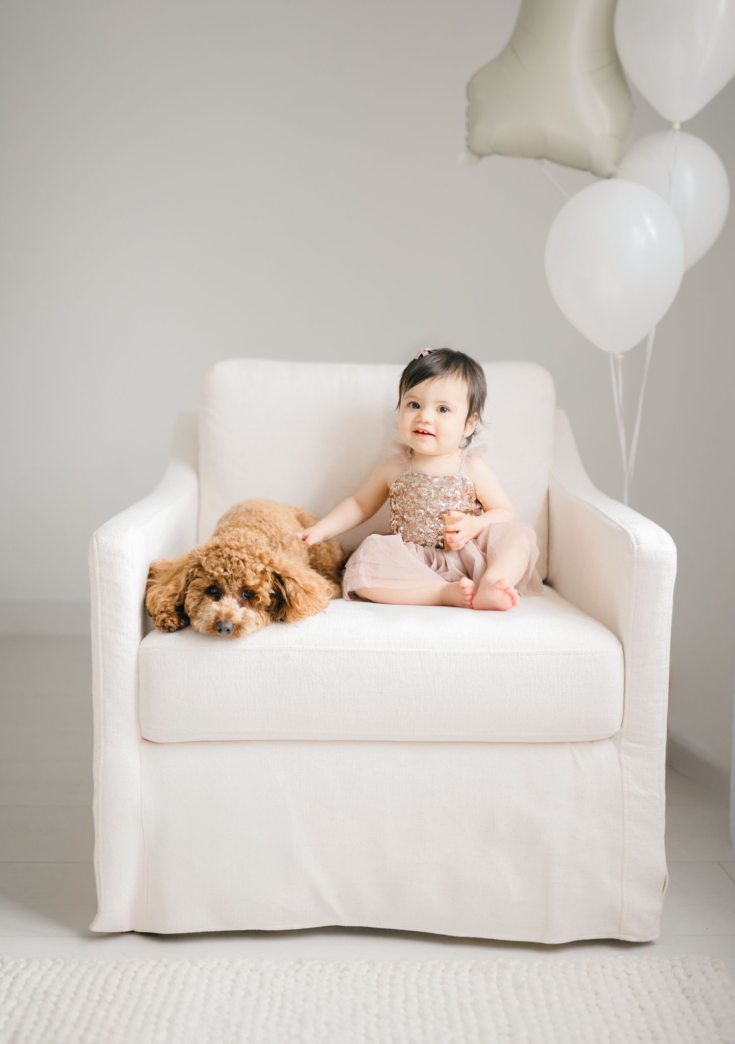 one year old and her puppy in studio by Richmond newborn photographer