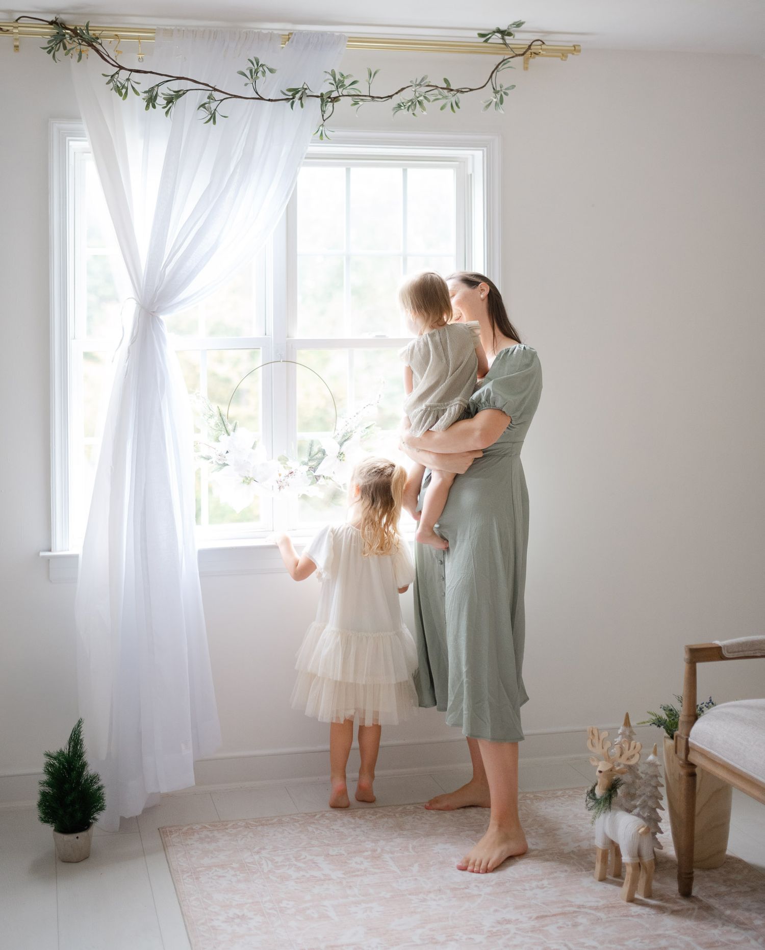 A series of intimate moments captured in a bright white room with flowing curtains and natural light streaming through windows.