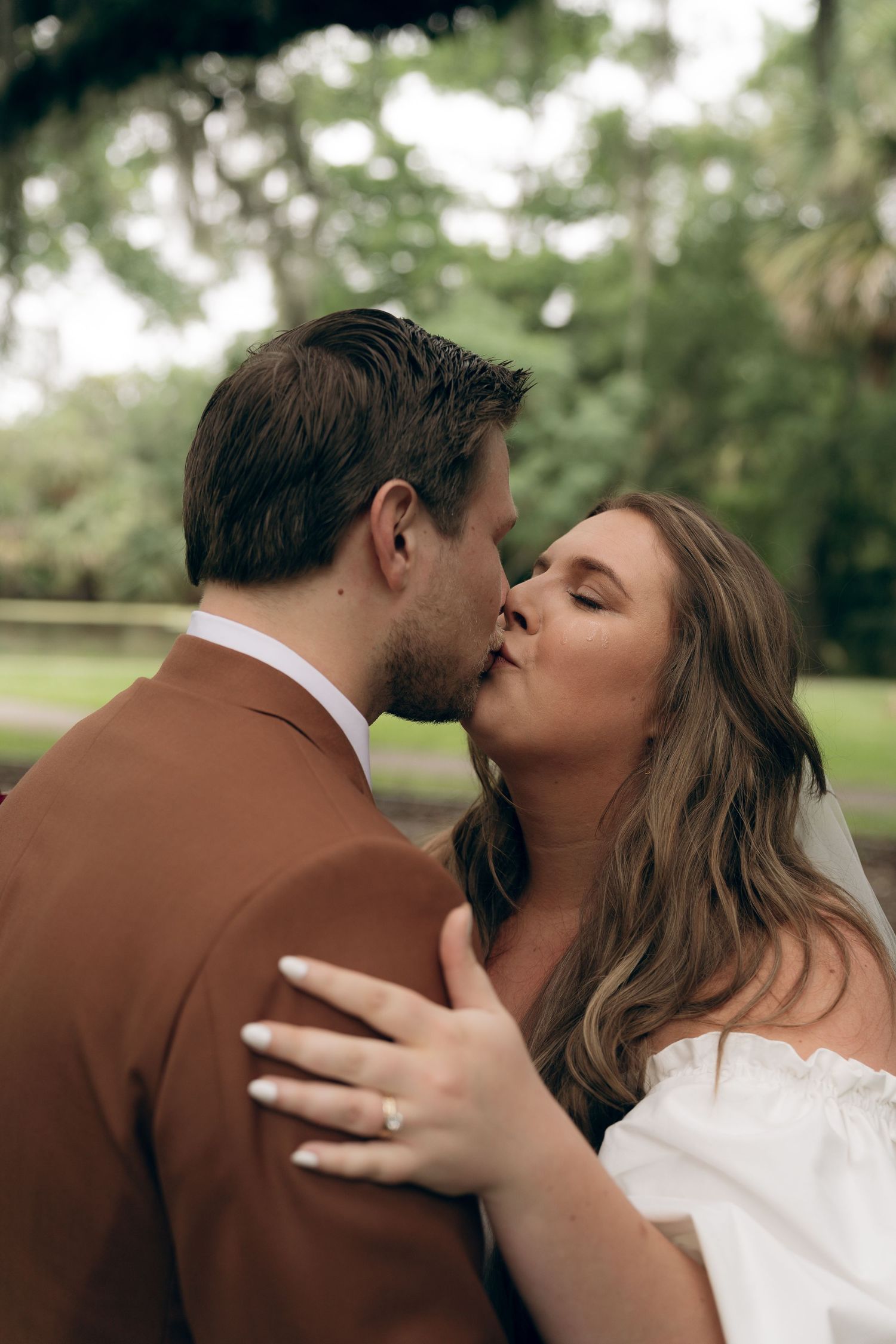 A romantic sequence shows a couple embracing and sharing a kiss in a natural outdoor setting.New Orleans