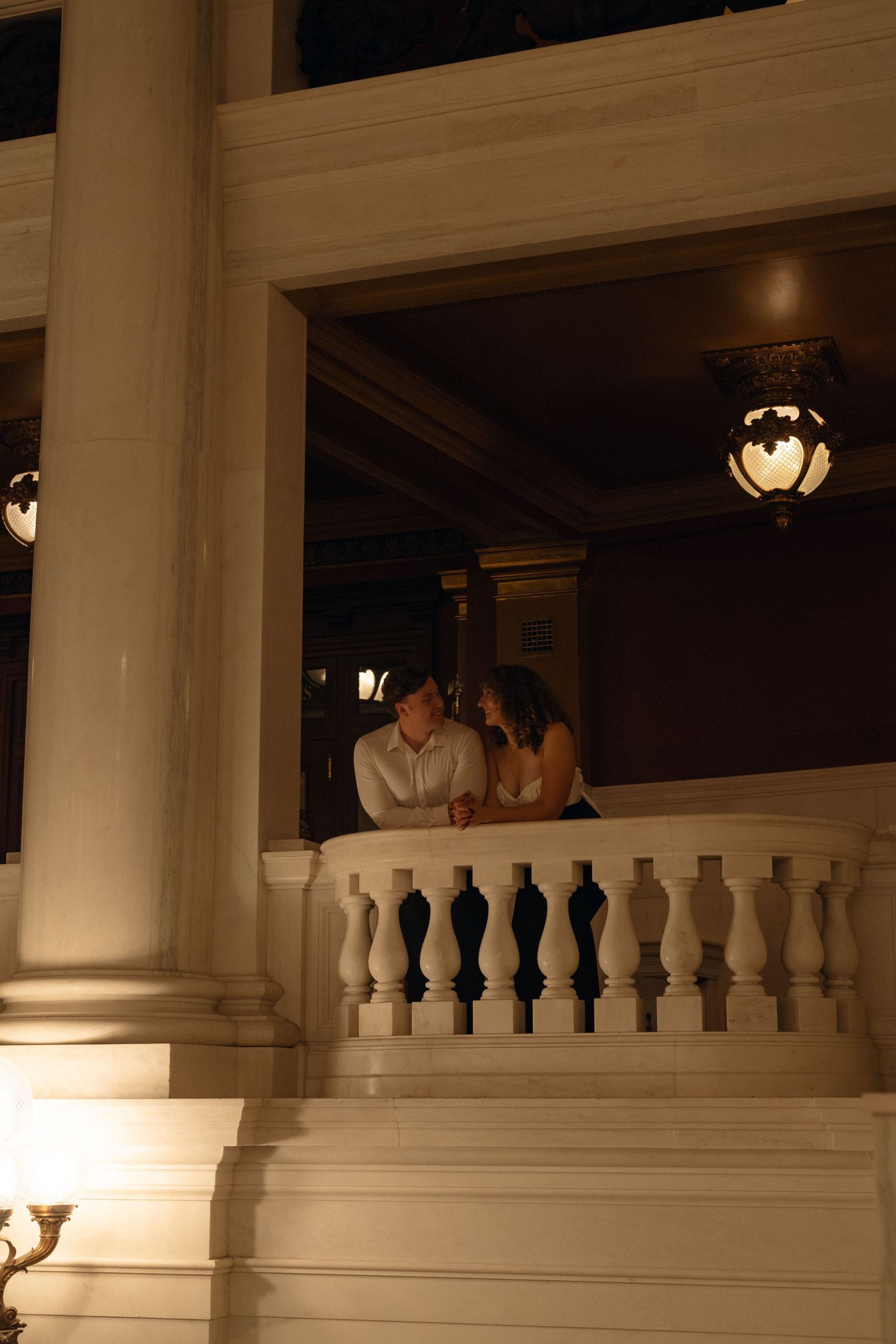 White balustrade railing in a grand historic building with classical architectural details.