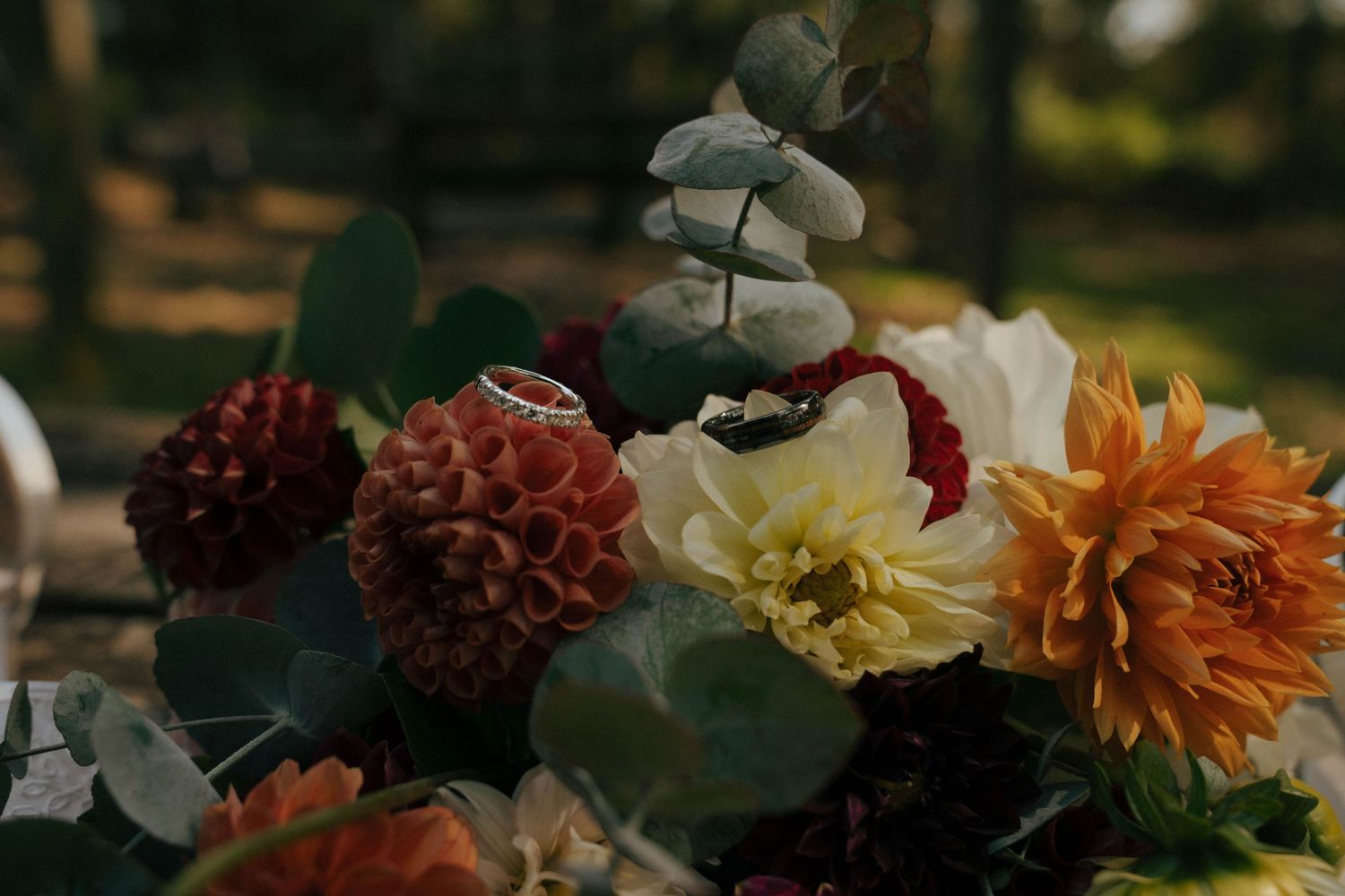 Beautiful autumn wedding bouquet with dahlias, eucalyptus and mixed flowers.