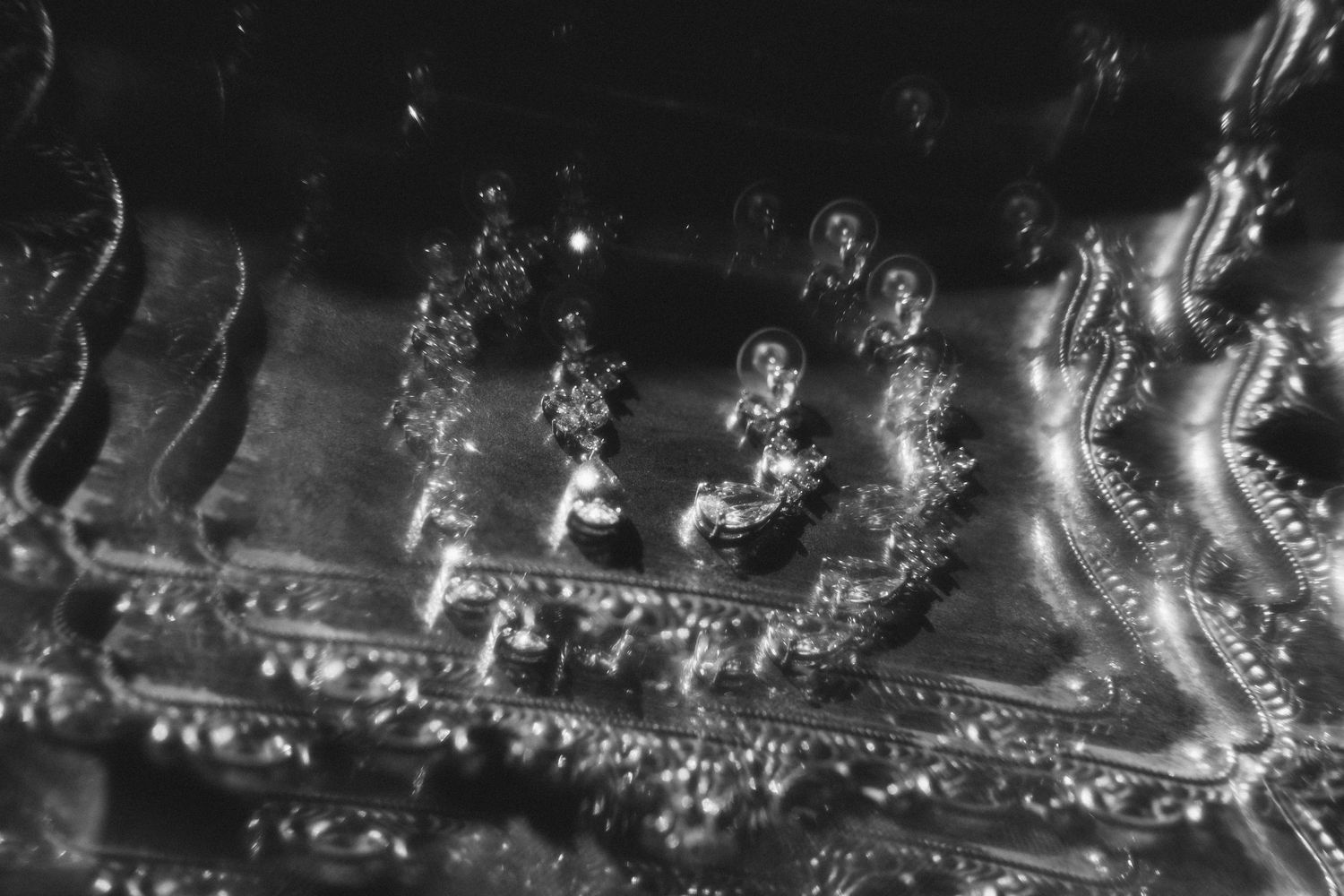 Abstract aerial night view showing glowing lights and patterns in a cityscape.