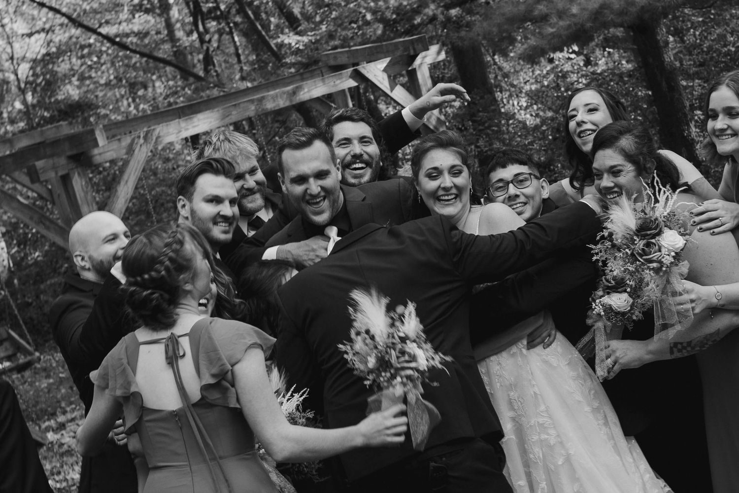 Vintage black and white wedding party group photo outdoors.