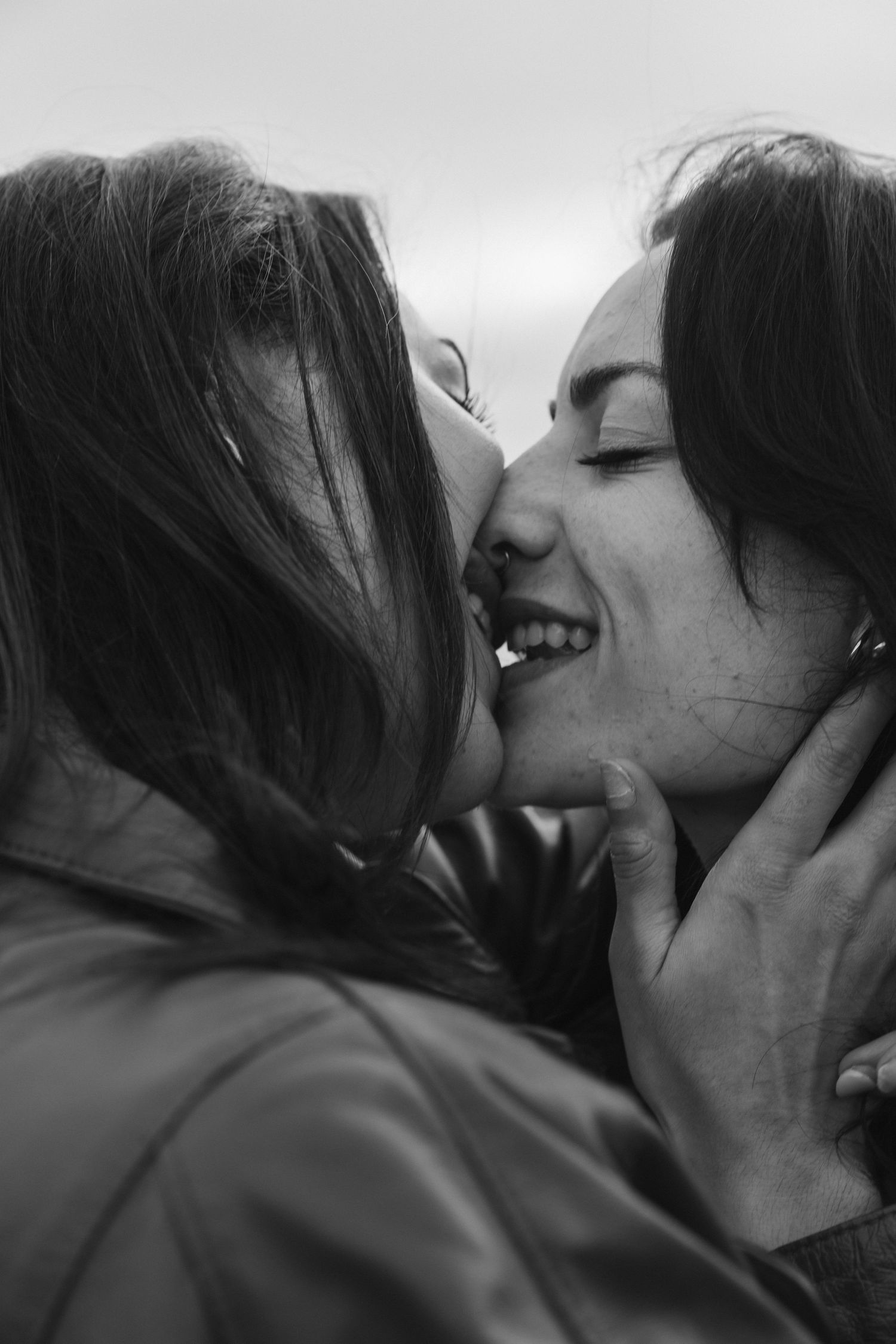 A sequence of black and white intimate kissing moments captured in a romantic photo collage.