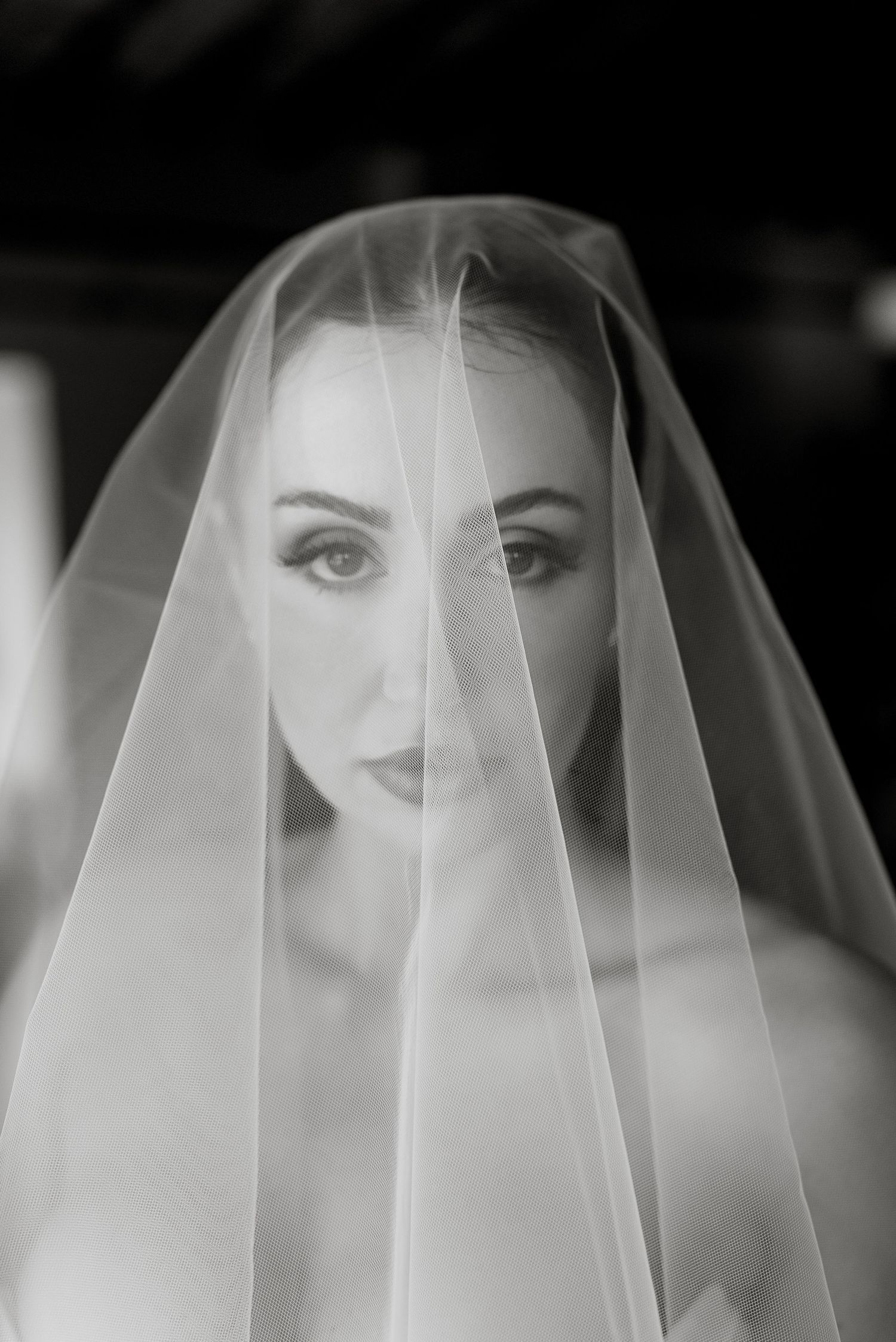 Sophisticated bride posing by a frescoed wall in a historic palace. High-end editorial photography for by Gradisca Portento