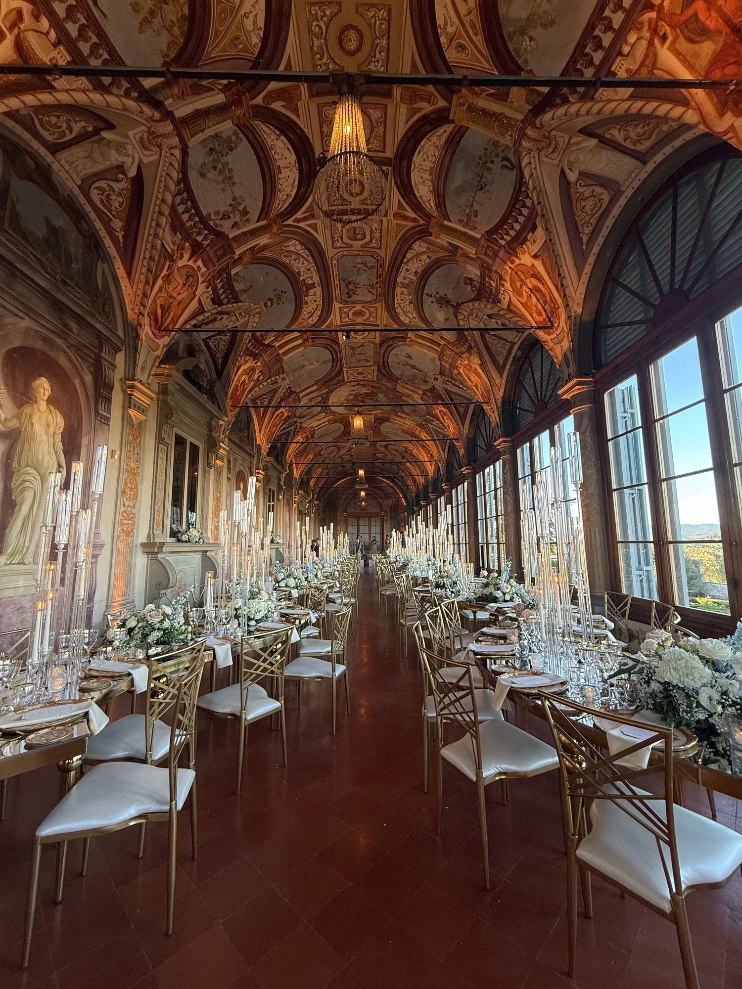 iPhone shot by Behind Wed Wedding Content Creator featuring a stunningly decorated dining hall for a luxury wedding in Tuscany