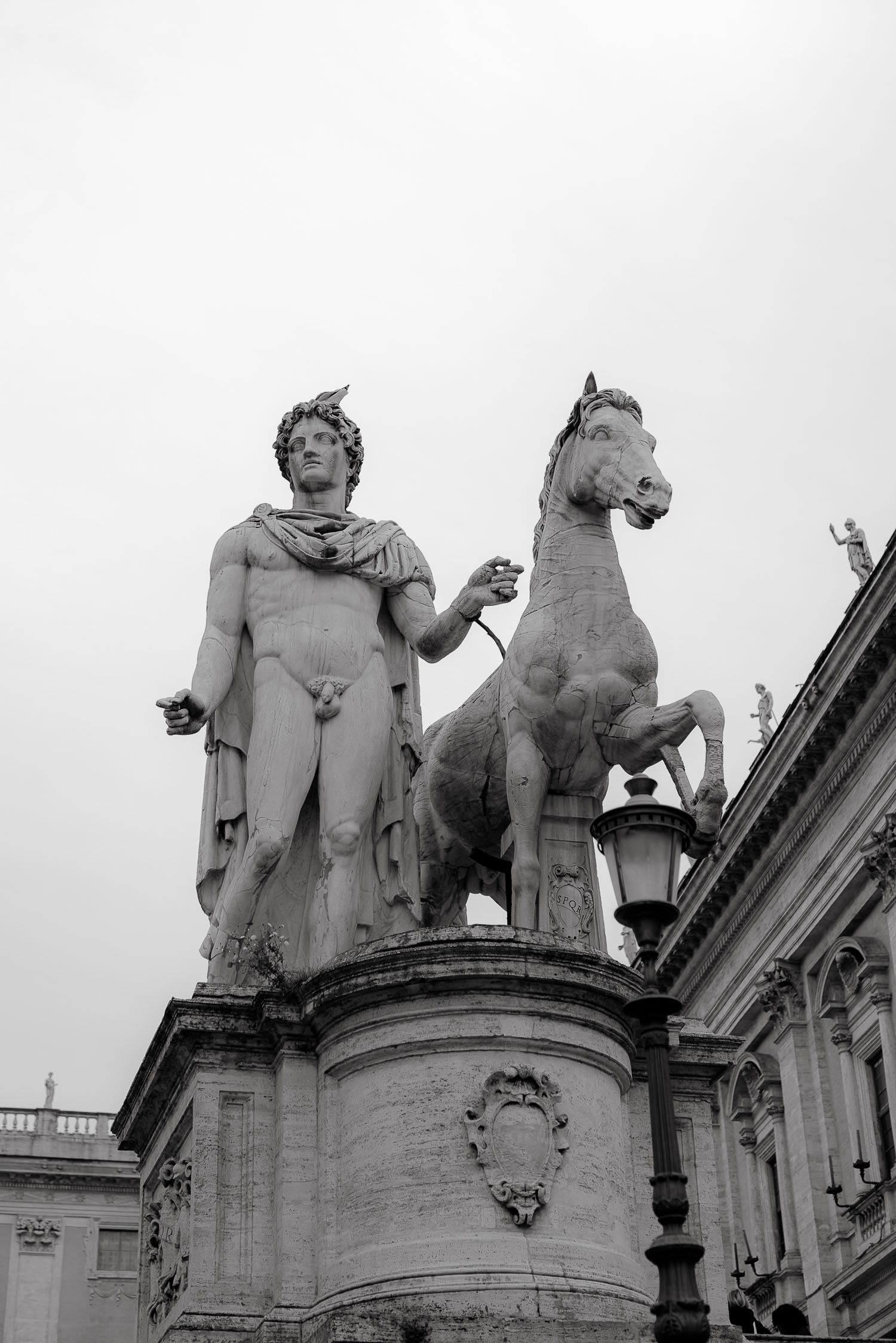 B&W shot of a Roman statue. Elegant and artistic wedding photography style in the Eternal City.