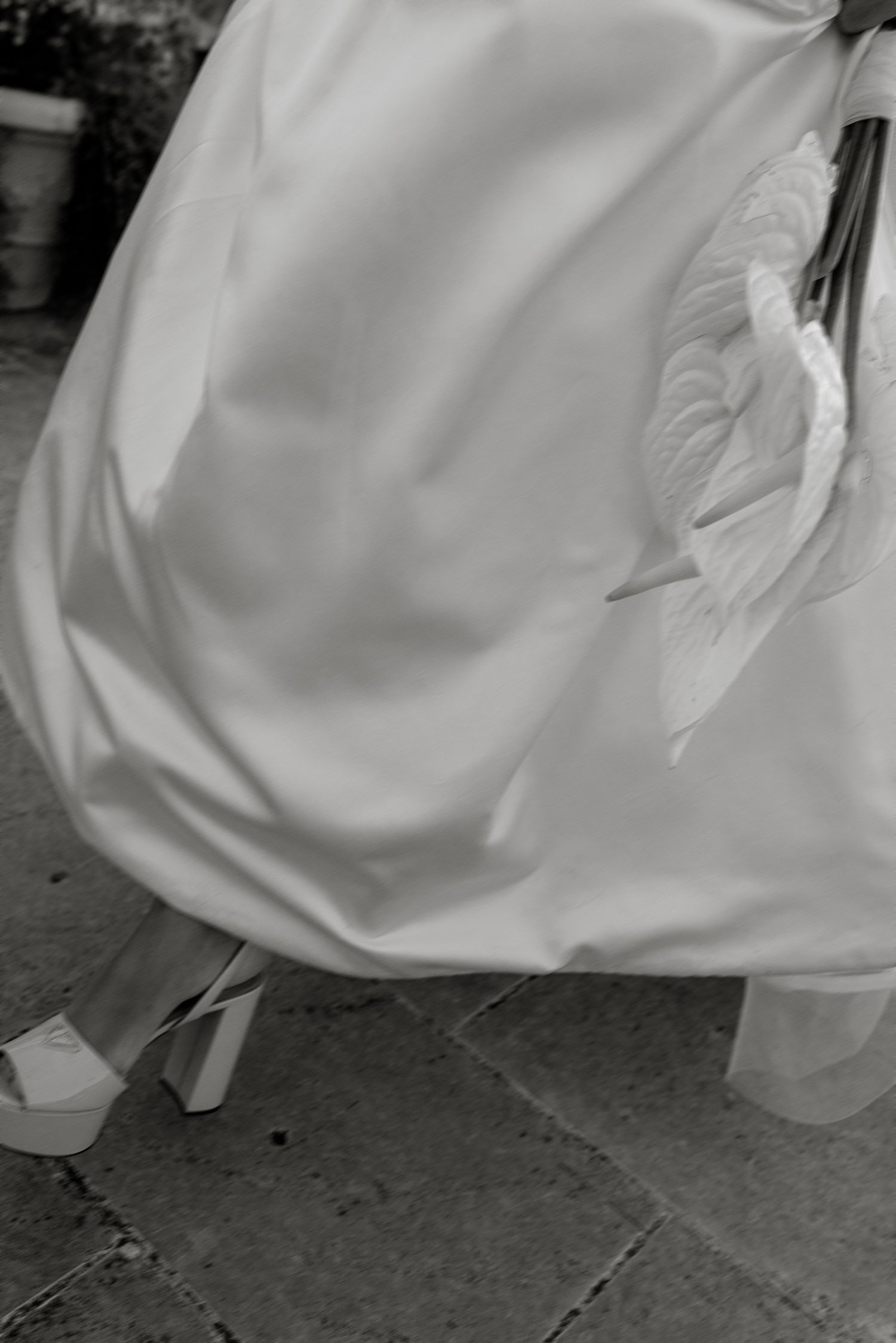 Artistic B&W motion blur of a bride at Pettolecchia Collection, Fasano. Contemporary wedding editorial.