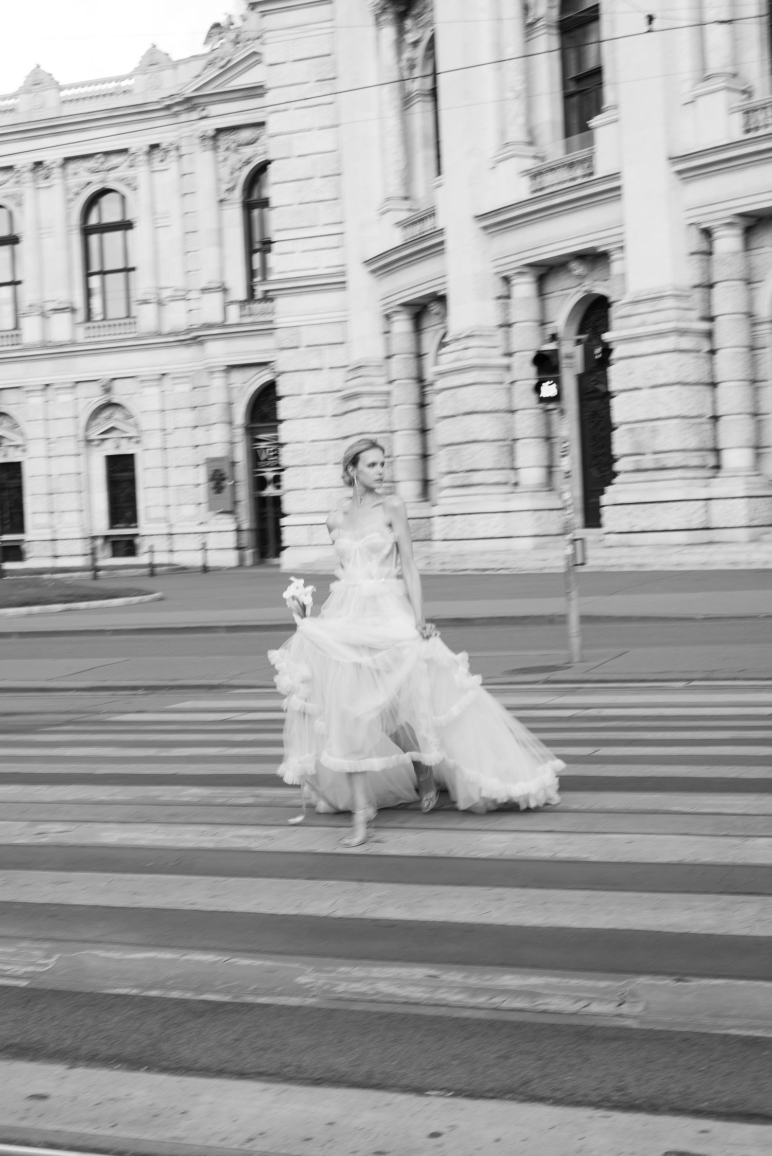 Cinematic shot of a bride strolling through an ancient Roman street. The essence of Italian Dolce Vita by Gradisca Portento.