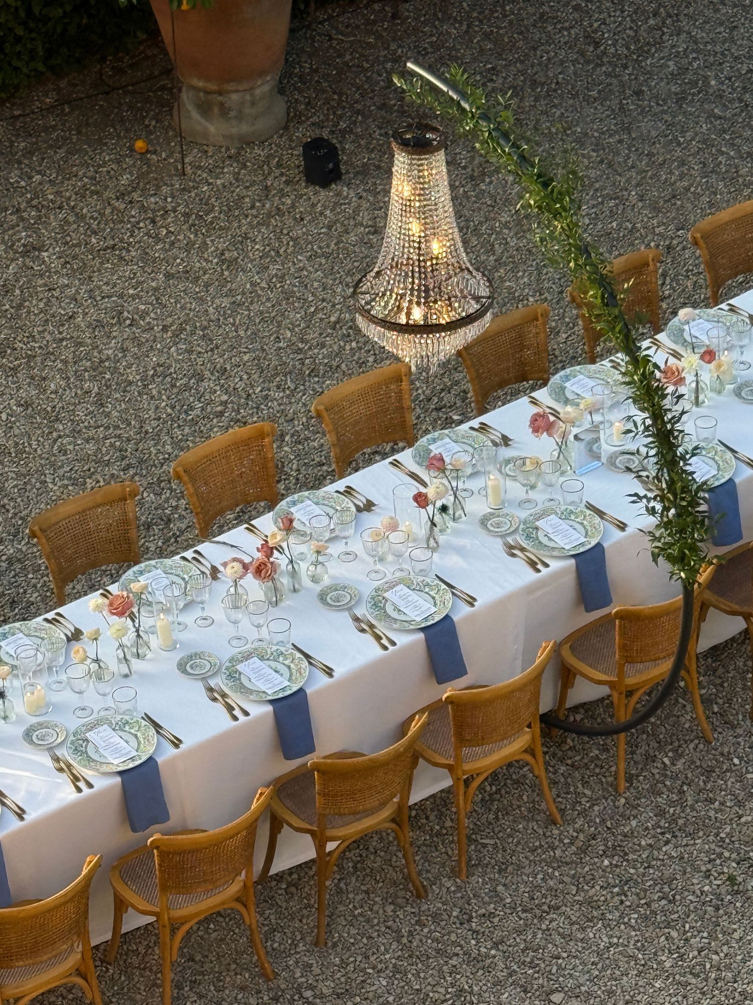High-angle shot of a luxurious long imperial table for a wedding at Villa il Garofalo, Florence by Behind Wed Wedding Content Creator
