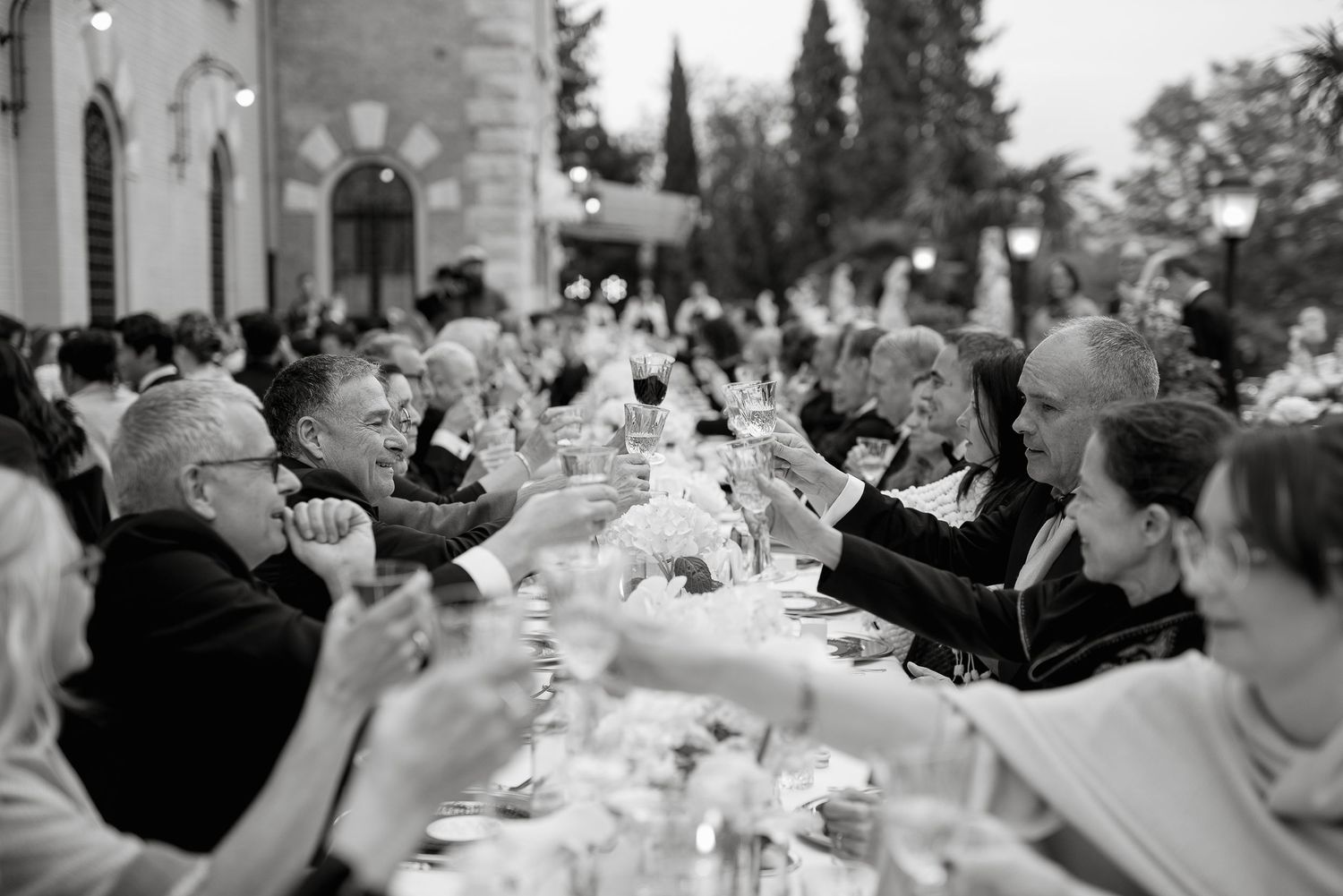 Guests toast at a luxury imperial table during an exclusive wedding in a historic Rome villa. Photography by Gradisca Portento