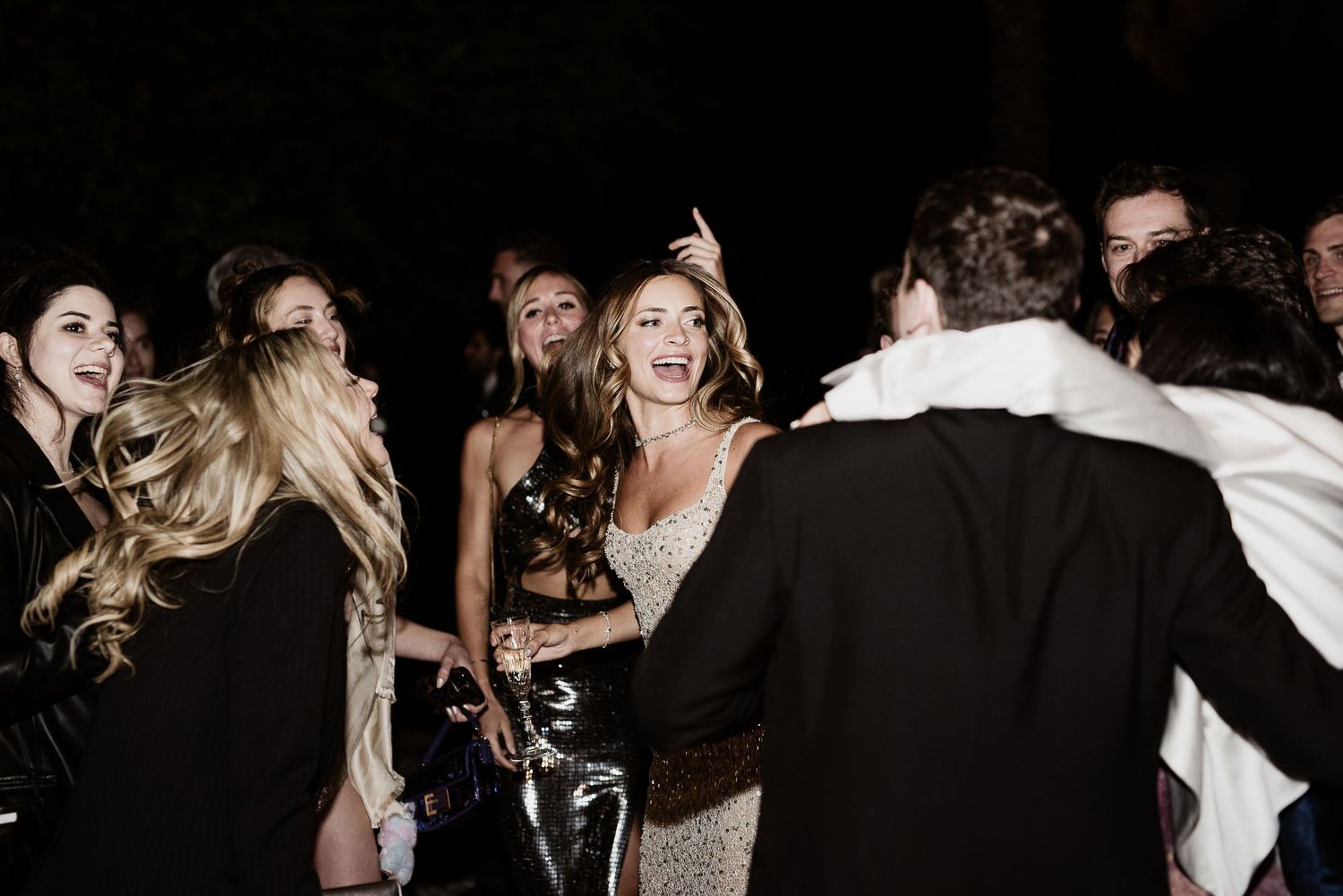 Candid joyful dance floor moment. Elegant destination wedding party in Tuscany by Gradisca Portento.