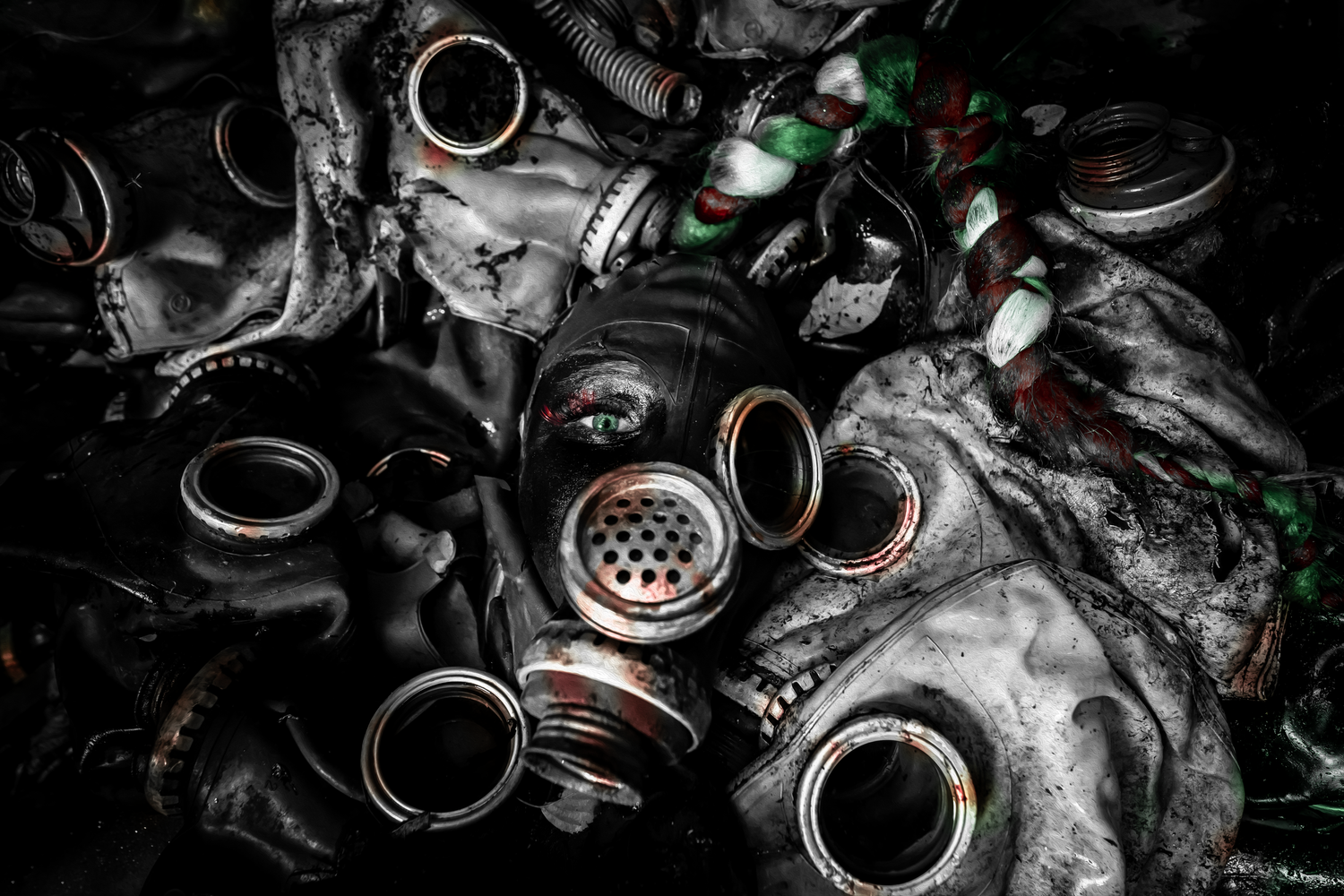A creative composition of scattered rings and jewelry displayed against a dark background with selective lighting effects.
