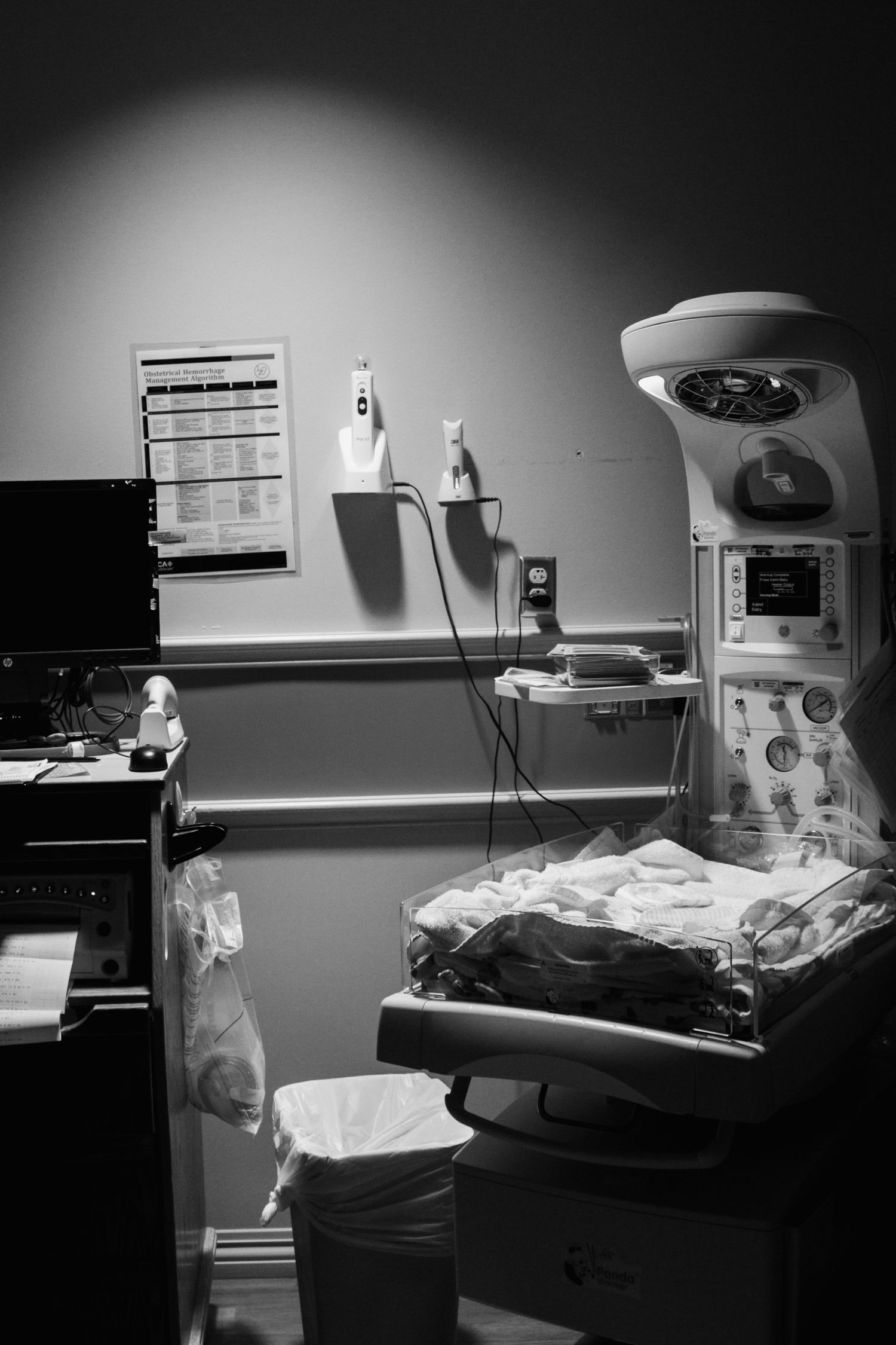 Black and white image of medical equipment in a hospital room.