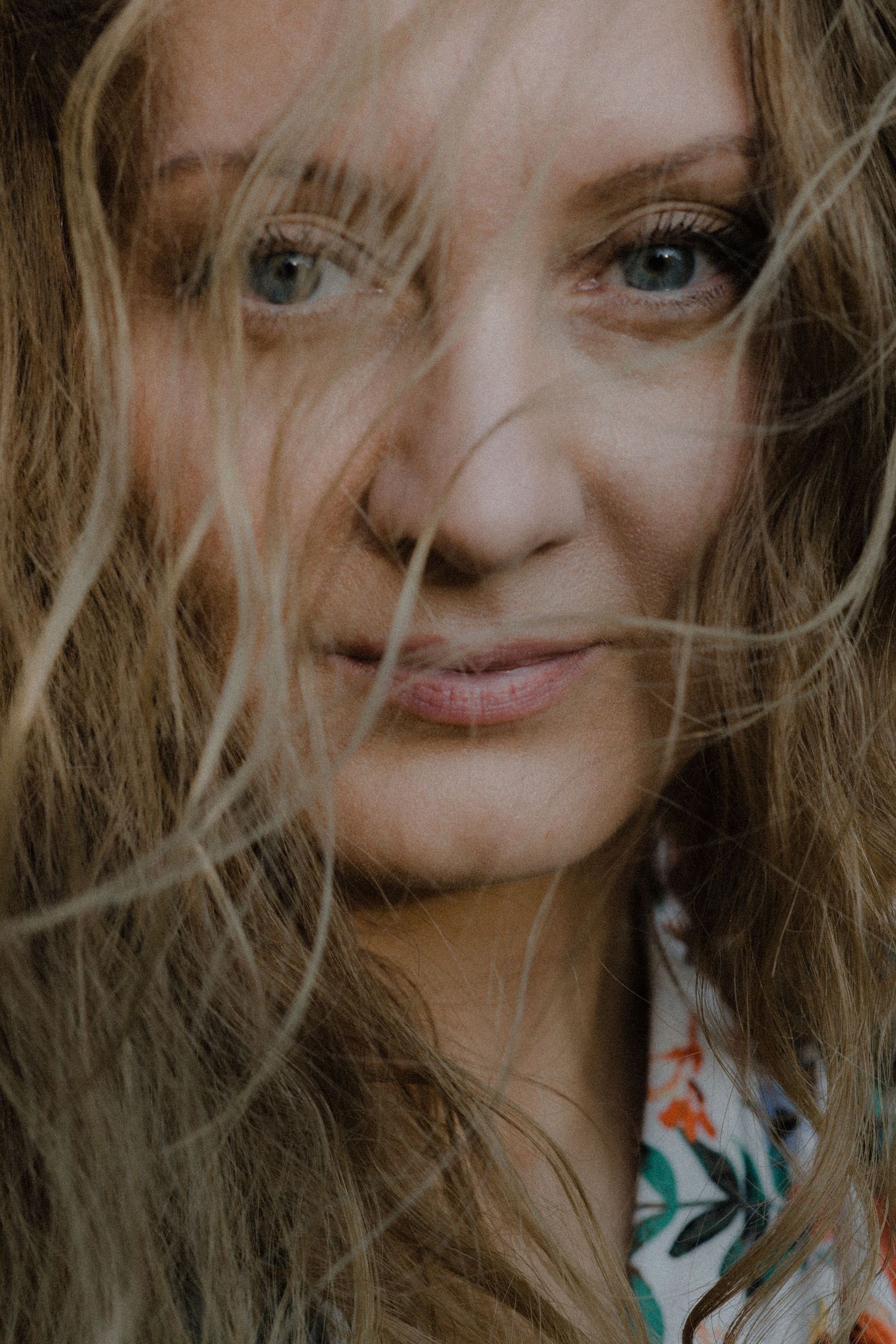 Close-up portrait sequence showing playful expressions and windswept hair.
