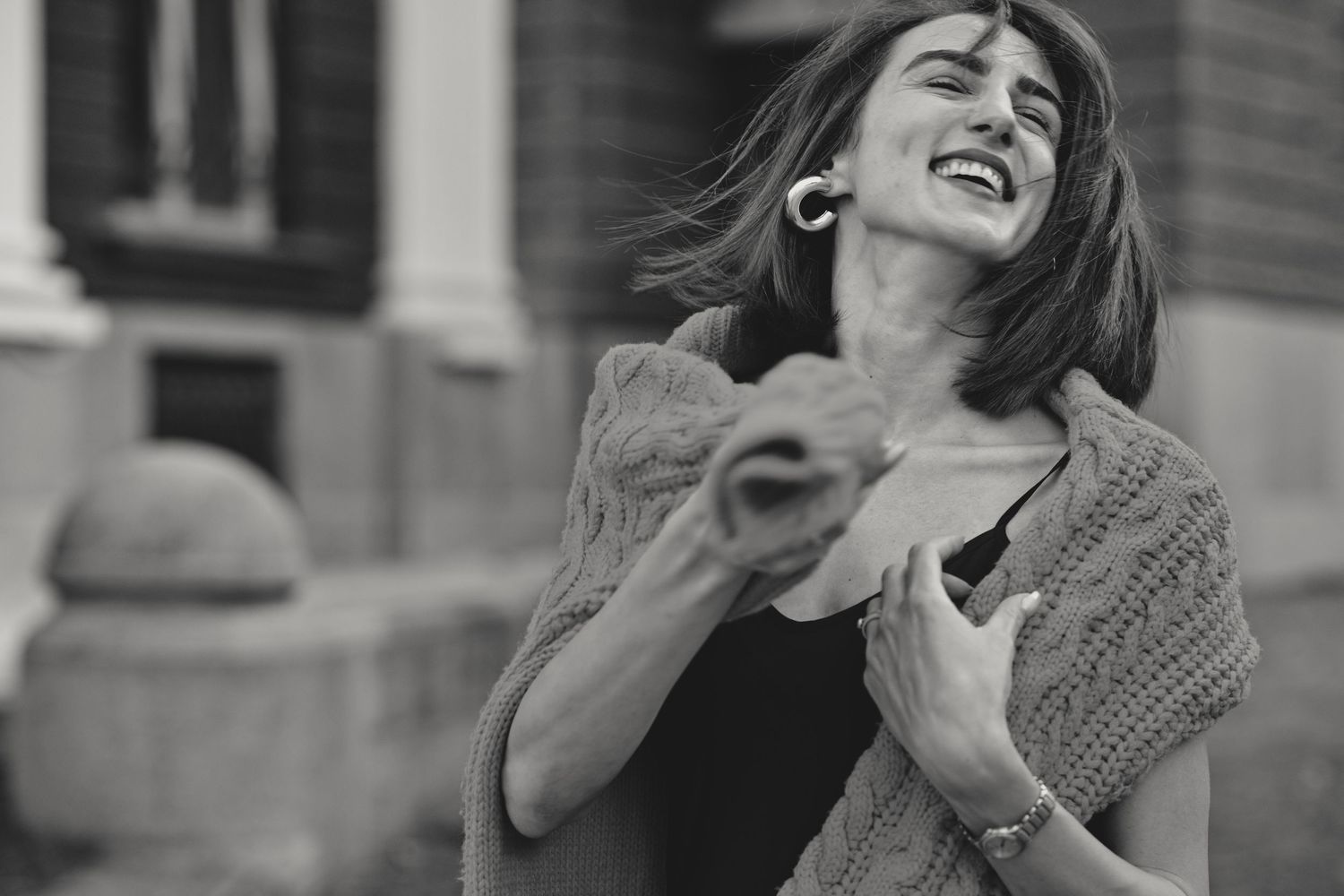 Series of black and white expressive portraits showing joy and laughter.