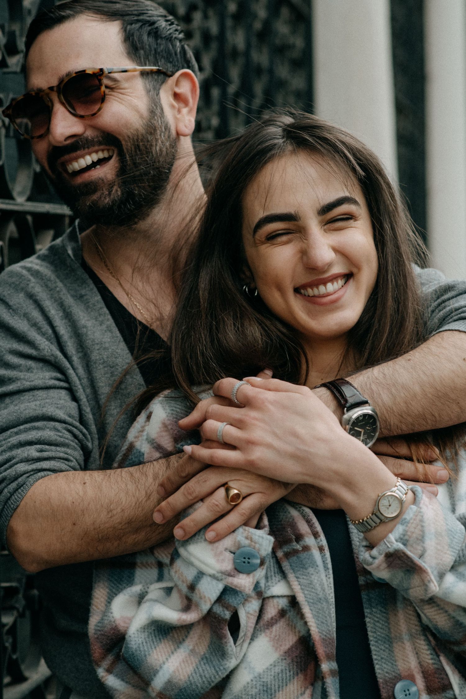 Playful couple sharing a tender moment while embracing.