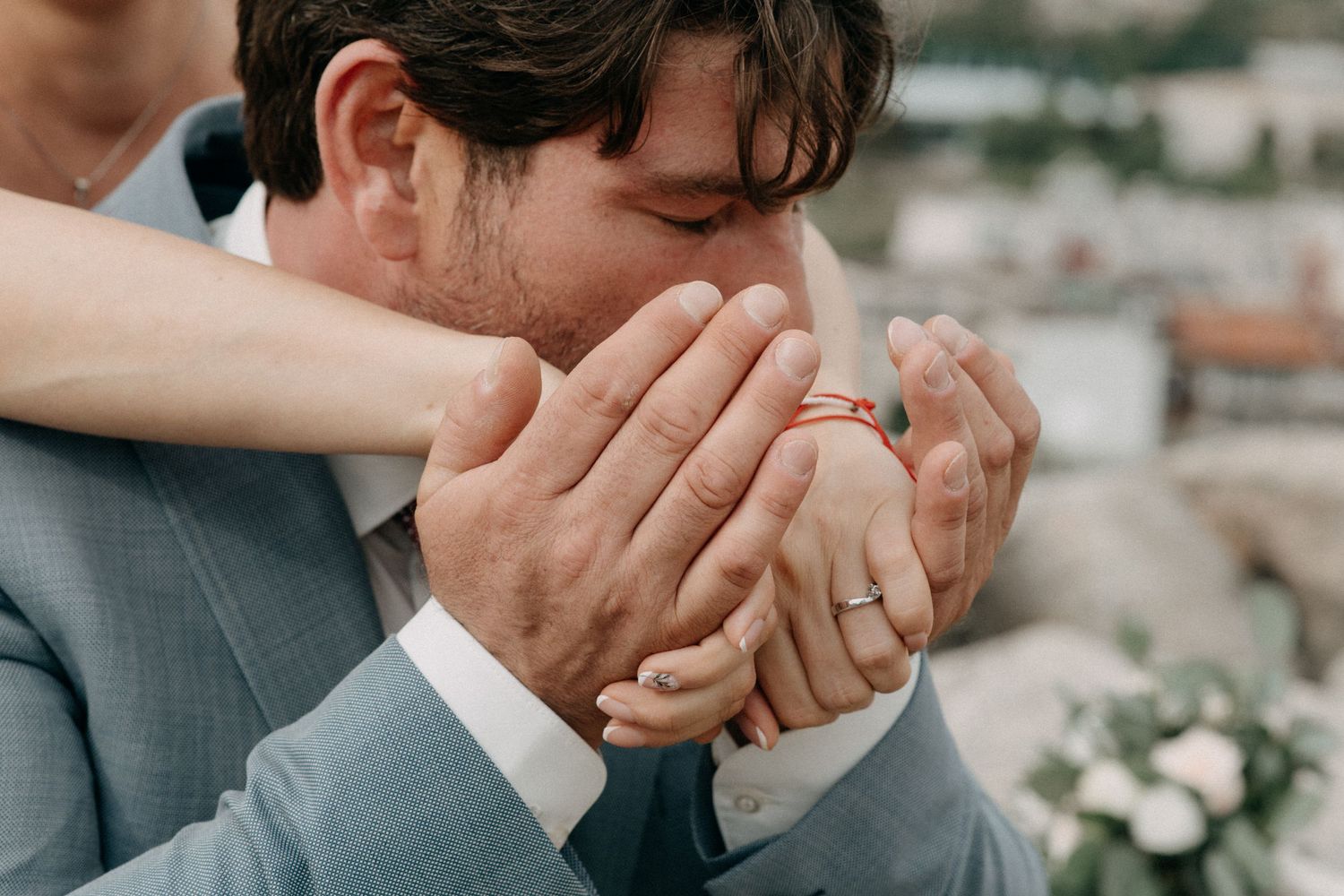 A romantic sequence showing tender hand-holding moments between a couple in formal attire.