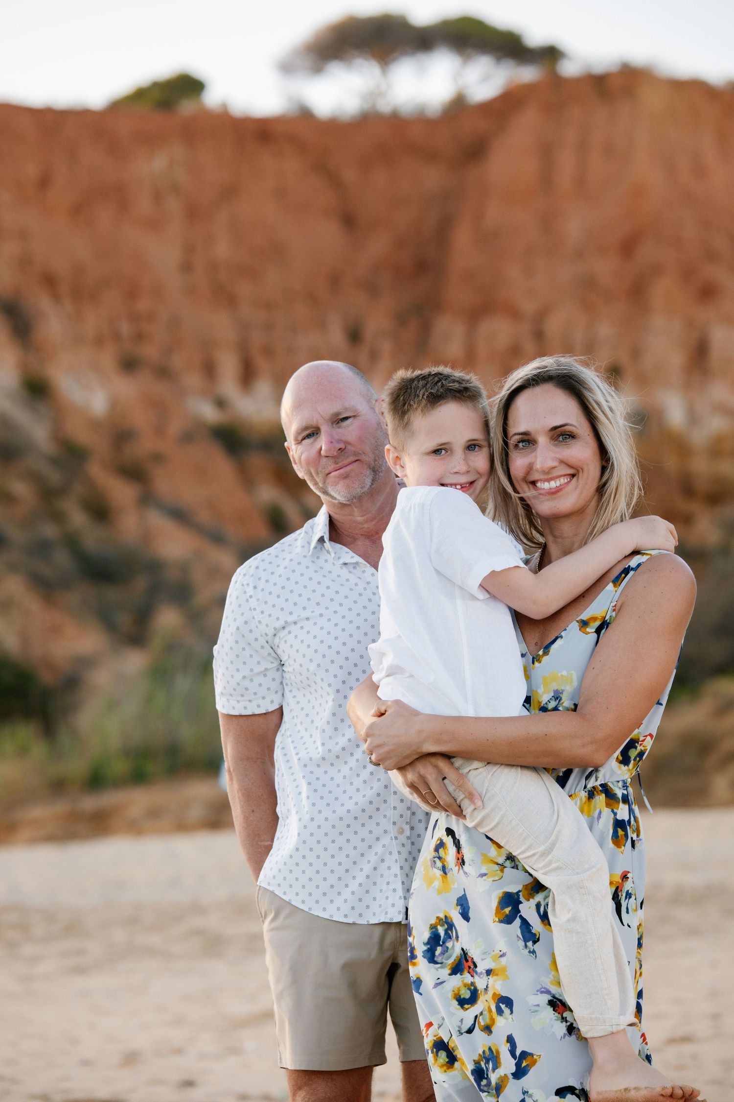 family posing for camera during a photoshoot in the algarve