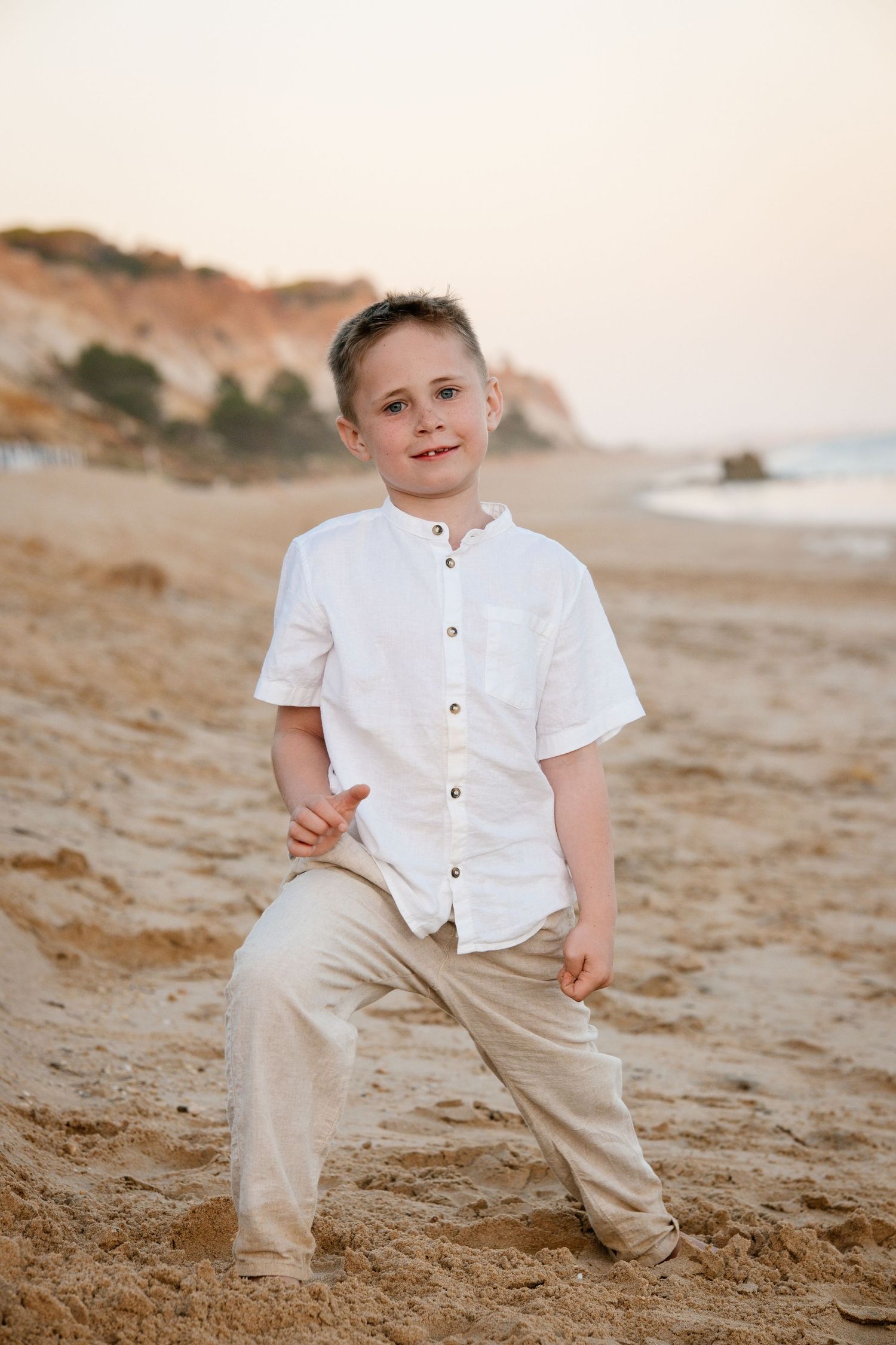 posing child on a beautiful coastline in Portugal