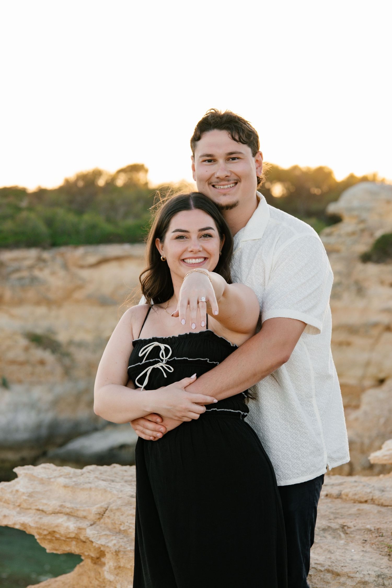 couple showing there engagement ring during elopement photoshoot