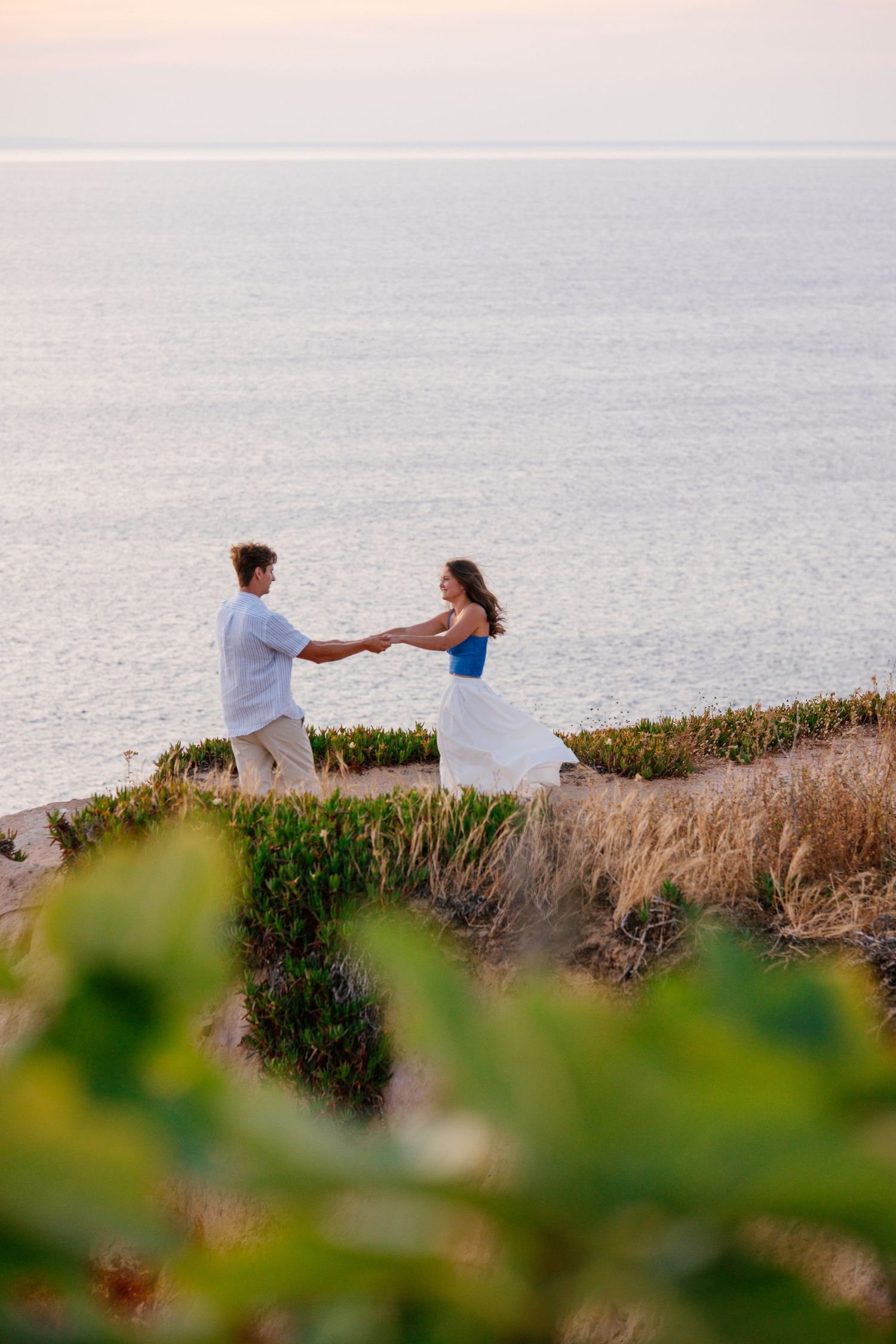couple dancing on the cliffs in Lagos