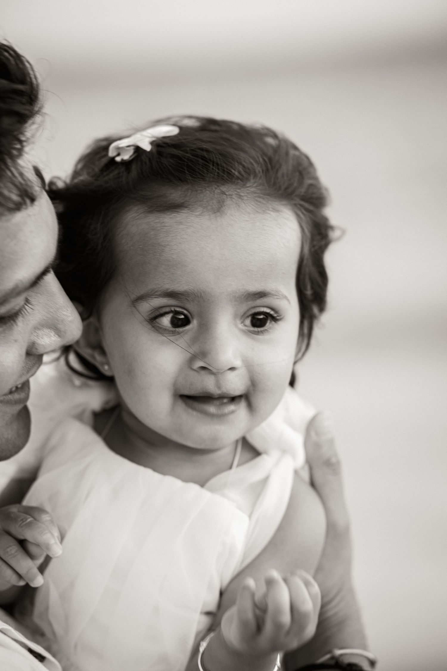 first birthday milestone portrait by the ocean at Praia Porto de Mós with natural candid moment