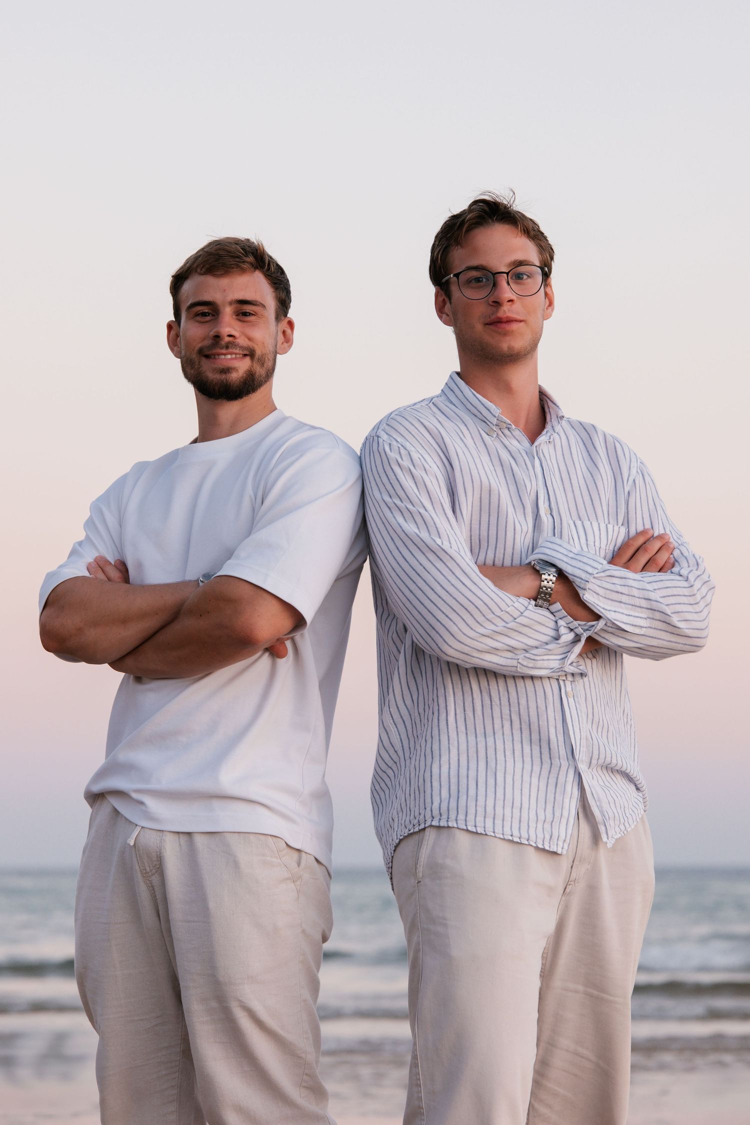 two brothers posing back-to-back in a fun, modern portrait style