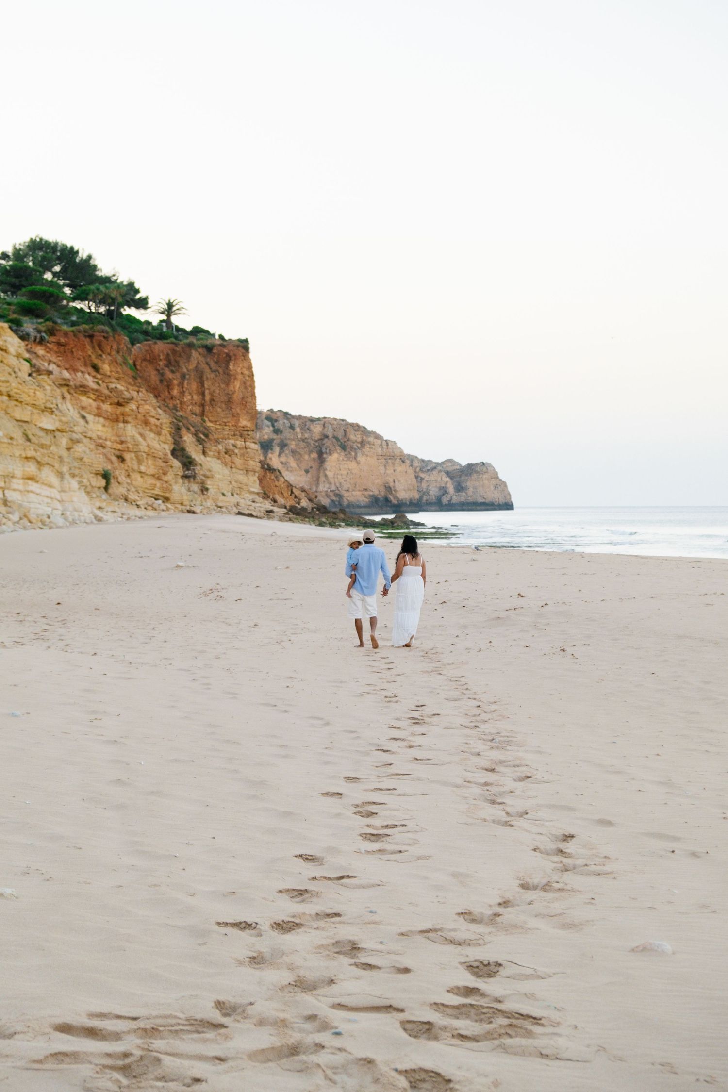 Family walking on the beach in Lagos Portugal