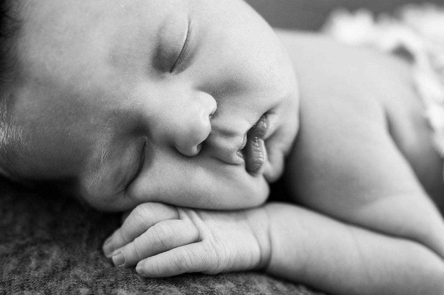 Tiny fingers and squishy lips—this black and white close-up captures all the fresh sweetness of a newborn photography session in Columbus