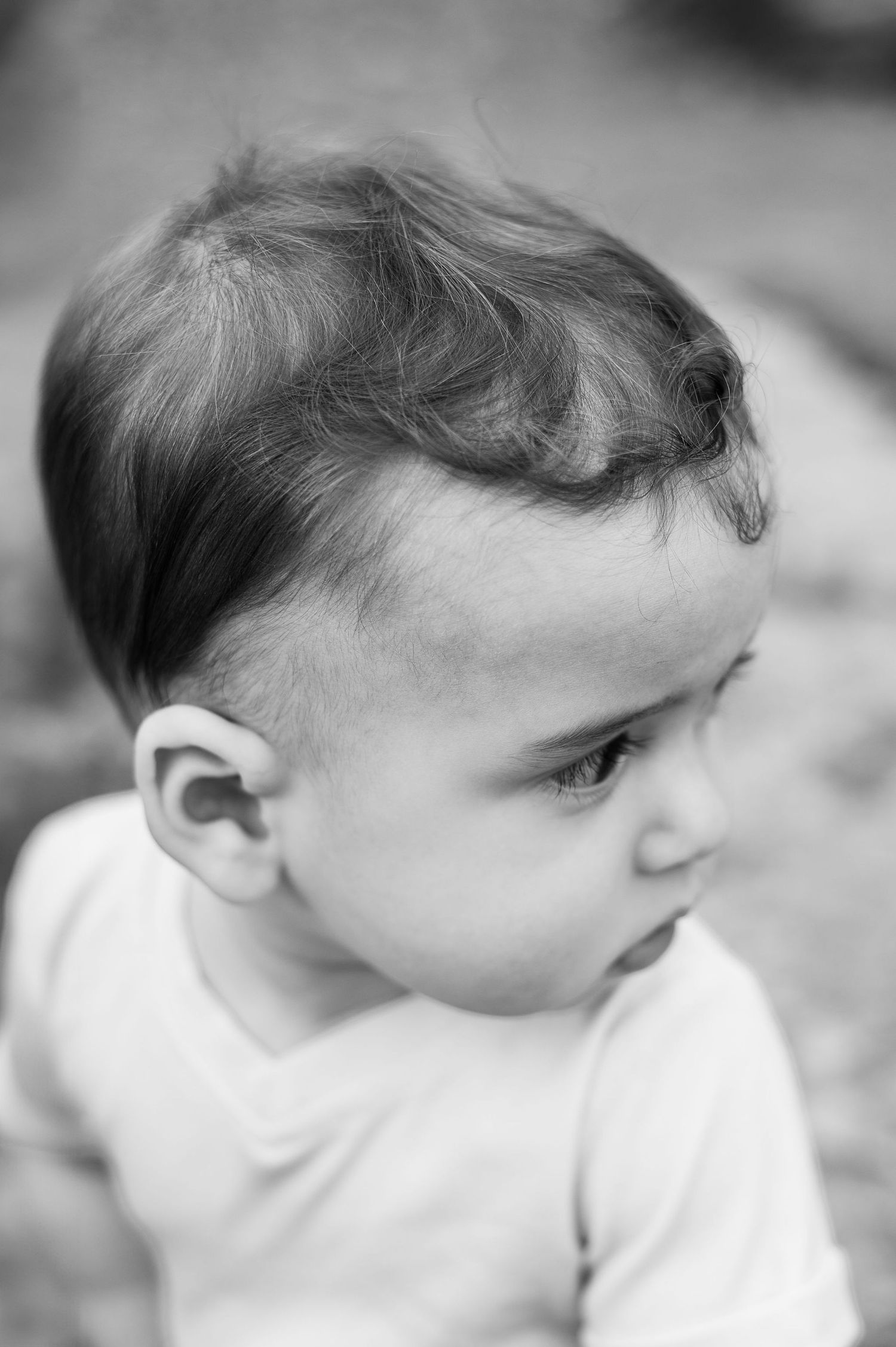 Black and white close-up of a toddler’s face and curls, a timeless moment captured during a Worthington milestone session.