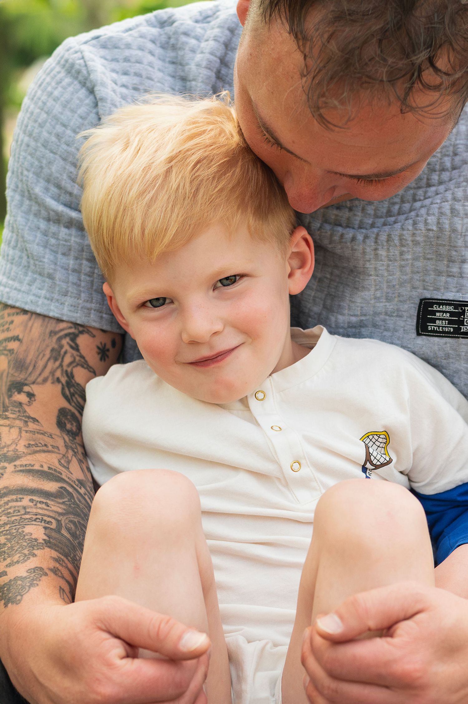 Gahanna family photography that sees the way he melts into his dad’s arms like home.