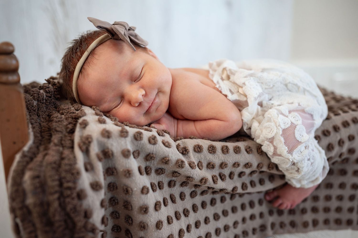 There’s nothing like that first sleepy newborn grin. A cozy session filled with lace, love, and those new baby snuggles.