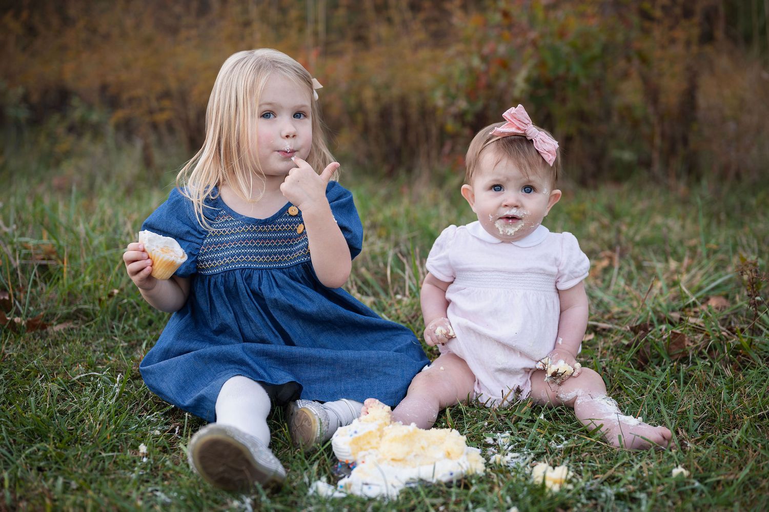 Milestone session at Sharon Woods Metro Park in Westerville, Ohio — sisters enjoying a joyful outdoor cupcake smash.