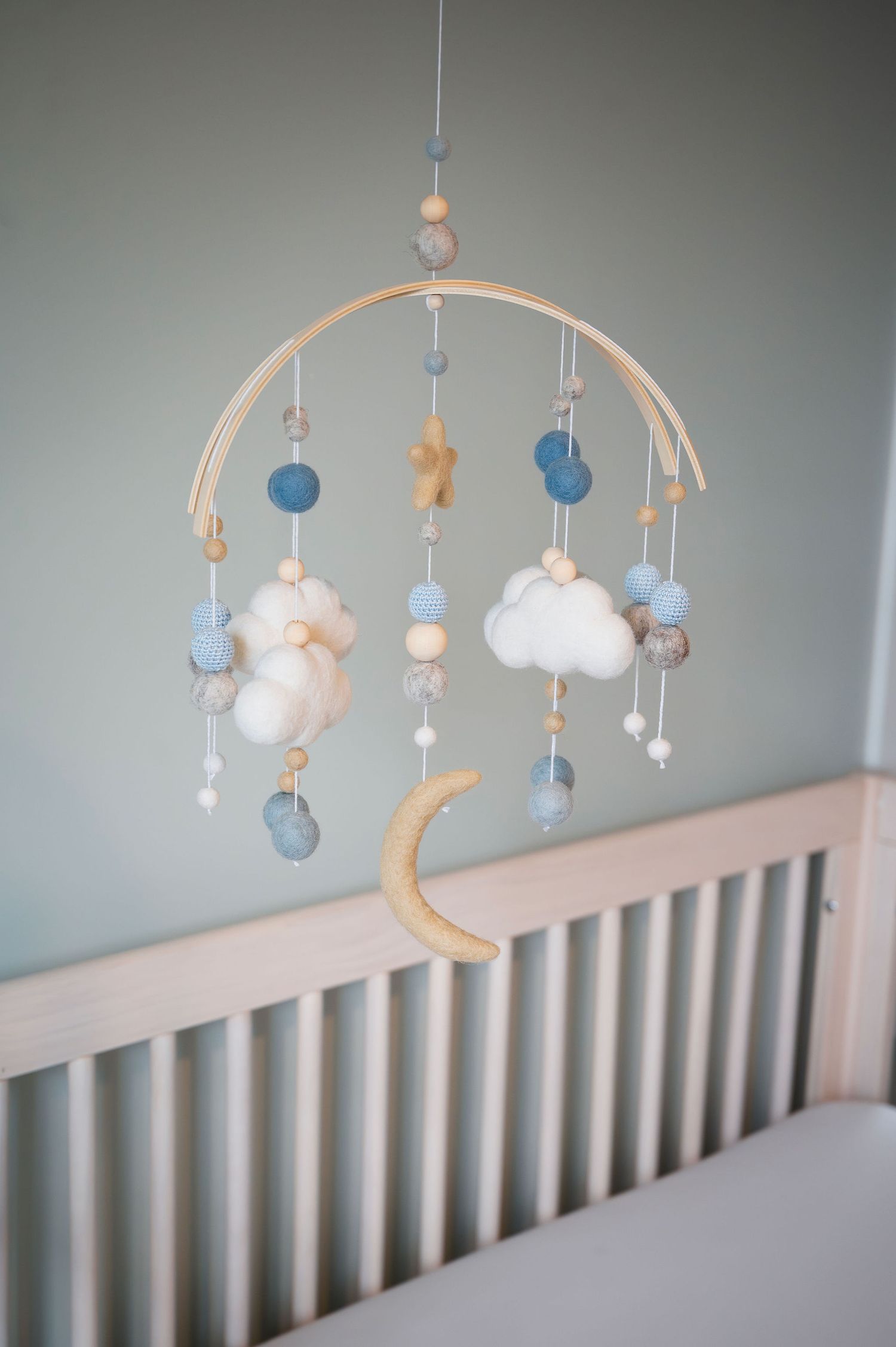 Neutral nursery mobile with moon and clouds—detail from Westerville newborn session prep