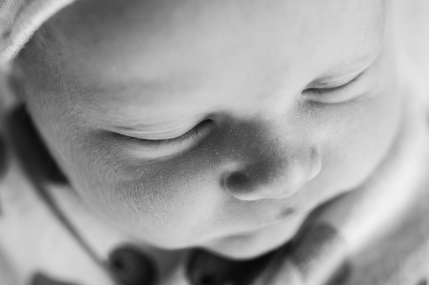 Close-up of newborn eyelashes and velvet skin—Westerville’s trusted newborn photographer capturing the tiniest details.